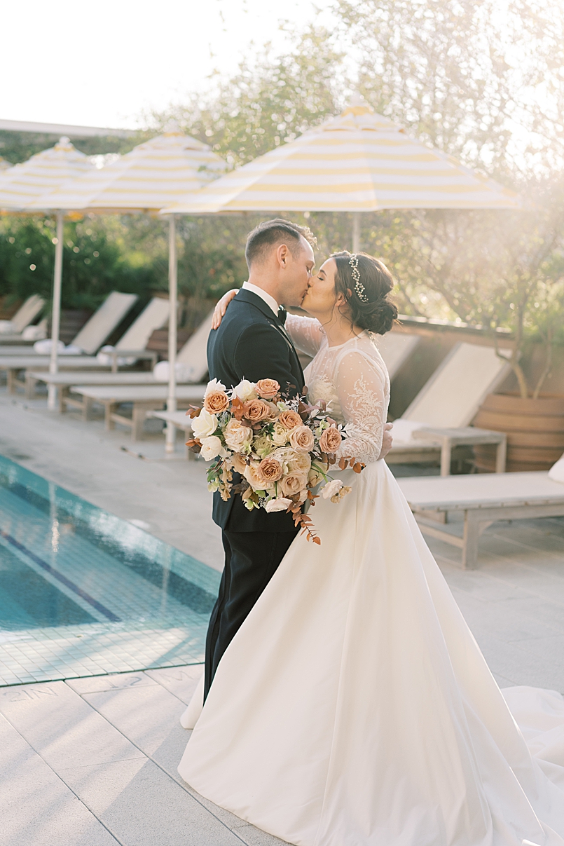 bride and groom portrait in pool area