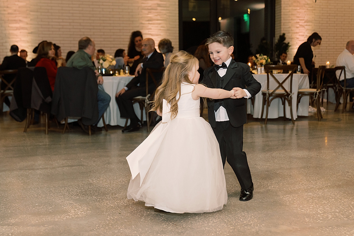 two kids dancing at wedding