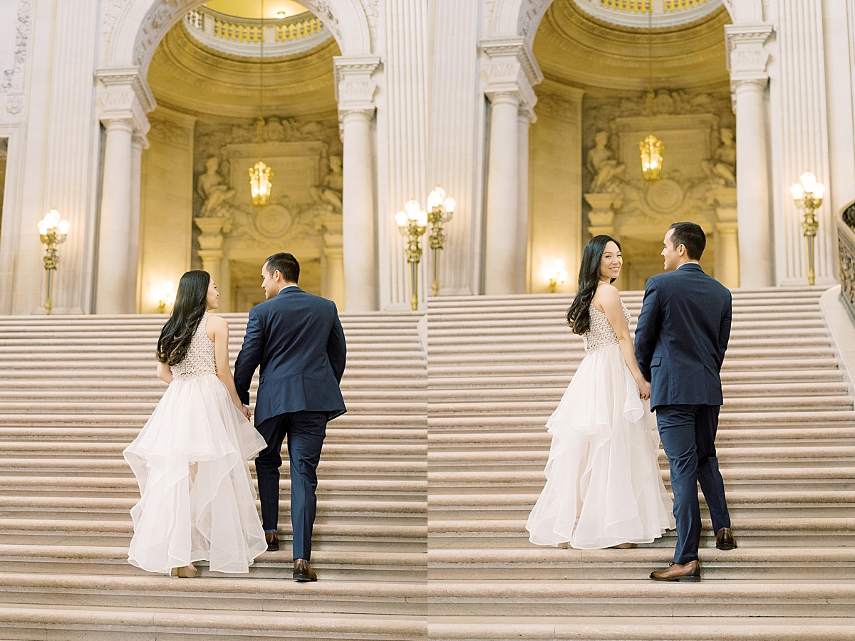 man and woman walking on stairs at San Francisco city hall