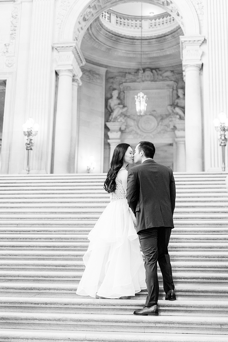 man and woman walking on stairs at San Francisco city hall