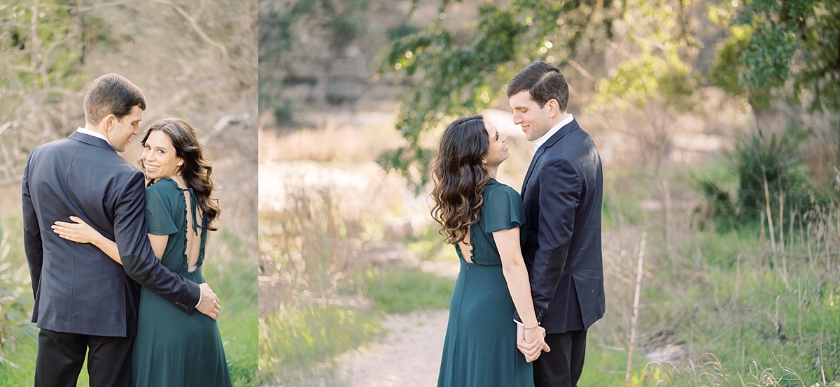 A gorgeous brunette looks over her shoulder while standing beside her tall, handsome partner in Bull Creek Park.