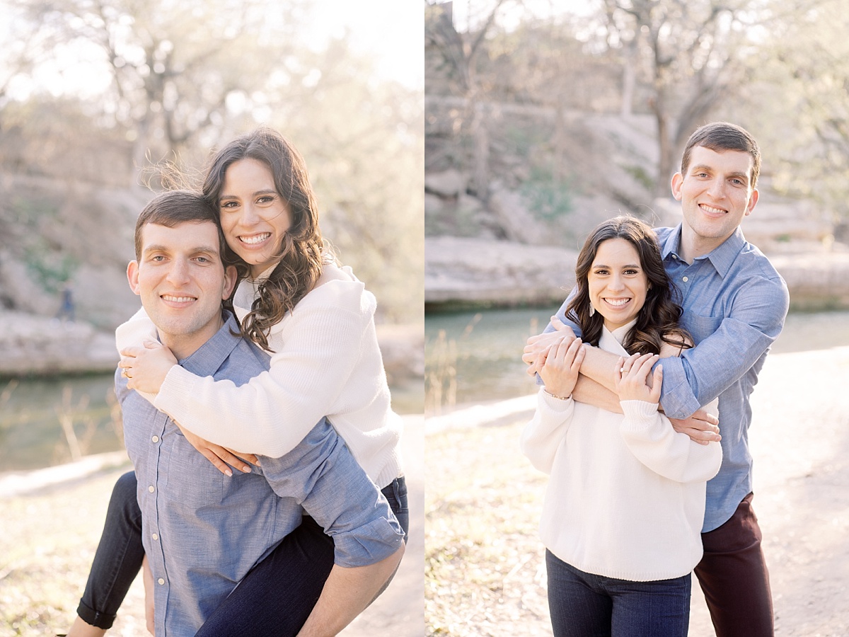 A brunette woman smiles as she is carried by her fiance during their golden hour engagement session in Texas.