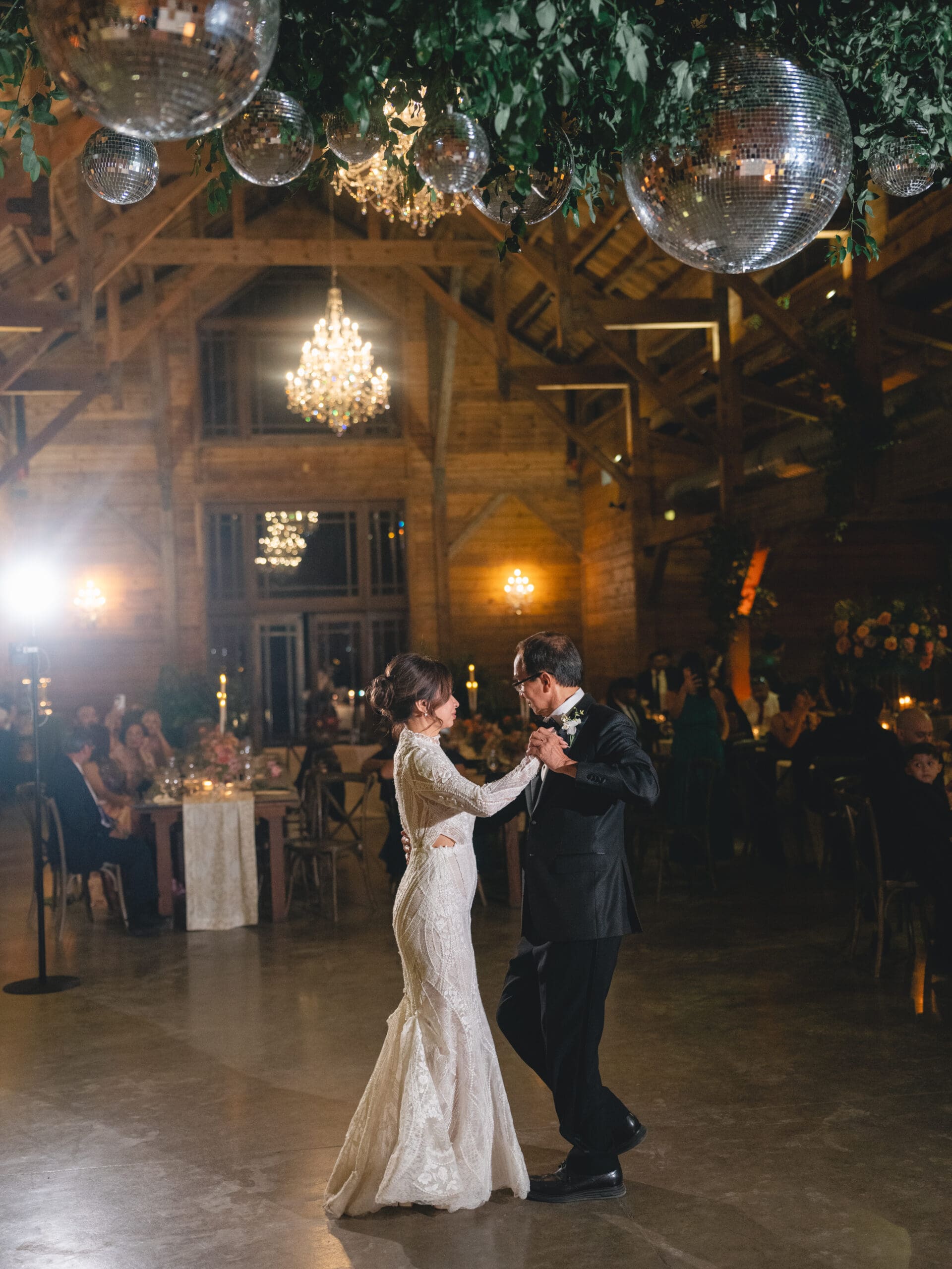 toasts Oanh and Jeremy in the barn at The Addison Grove surrounded by friends and family