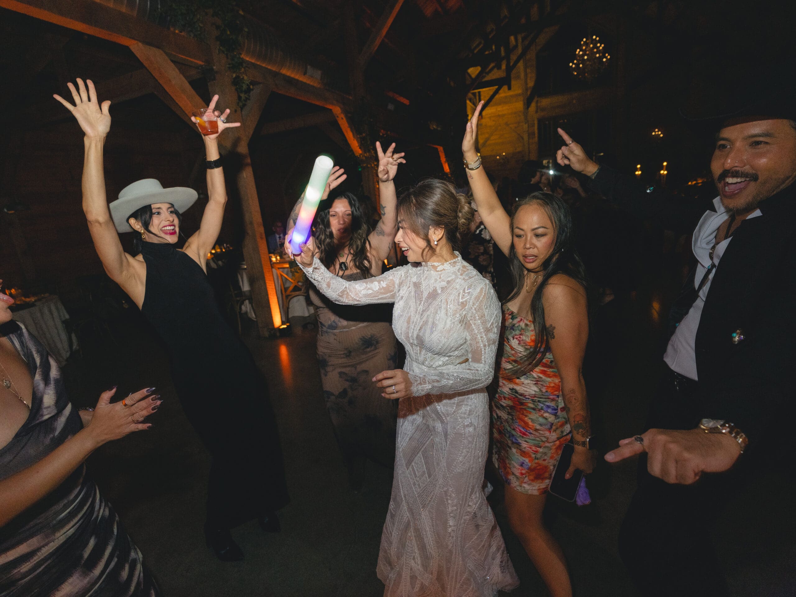 Guests celebrating and dancing on the dance floor at The Addison Grove wedding reception