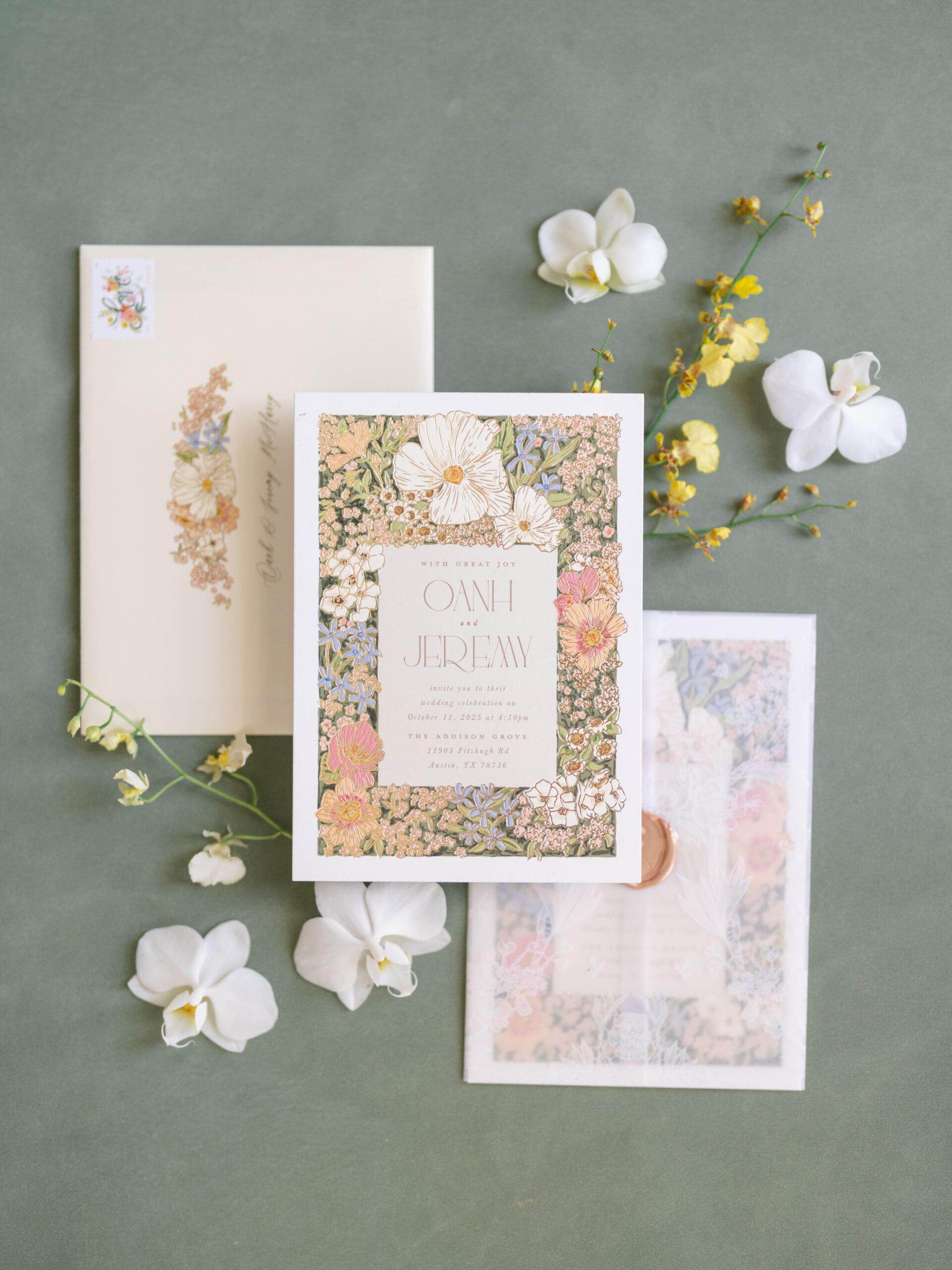 Detail photo of invitation suite, rings, and florals from Oanh and Jeremy’s Addison Grove wedding captured by Paige Vaughn Photo
