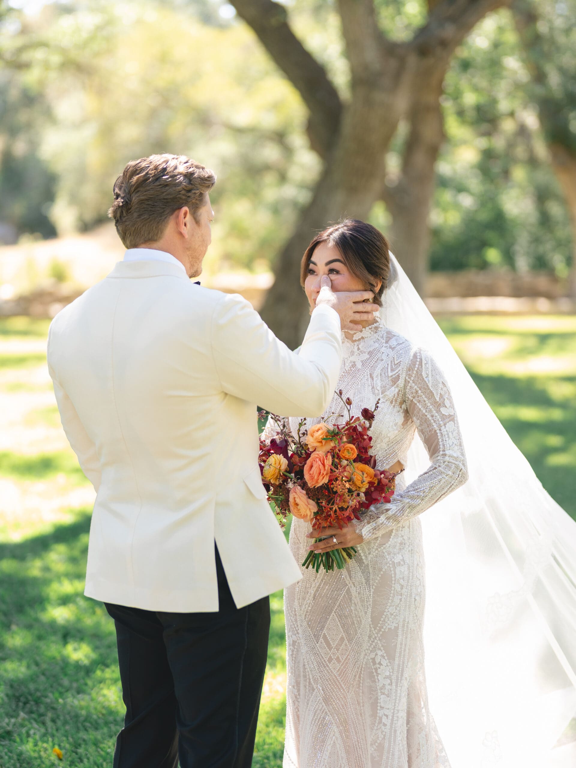Romantic portrait of Oanh and Jeremy under the oak trees at The Addison Grove, captured on film
