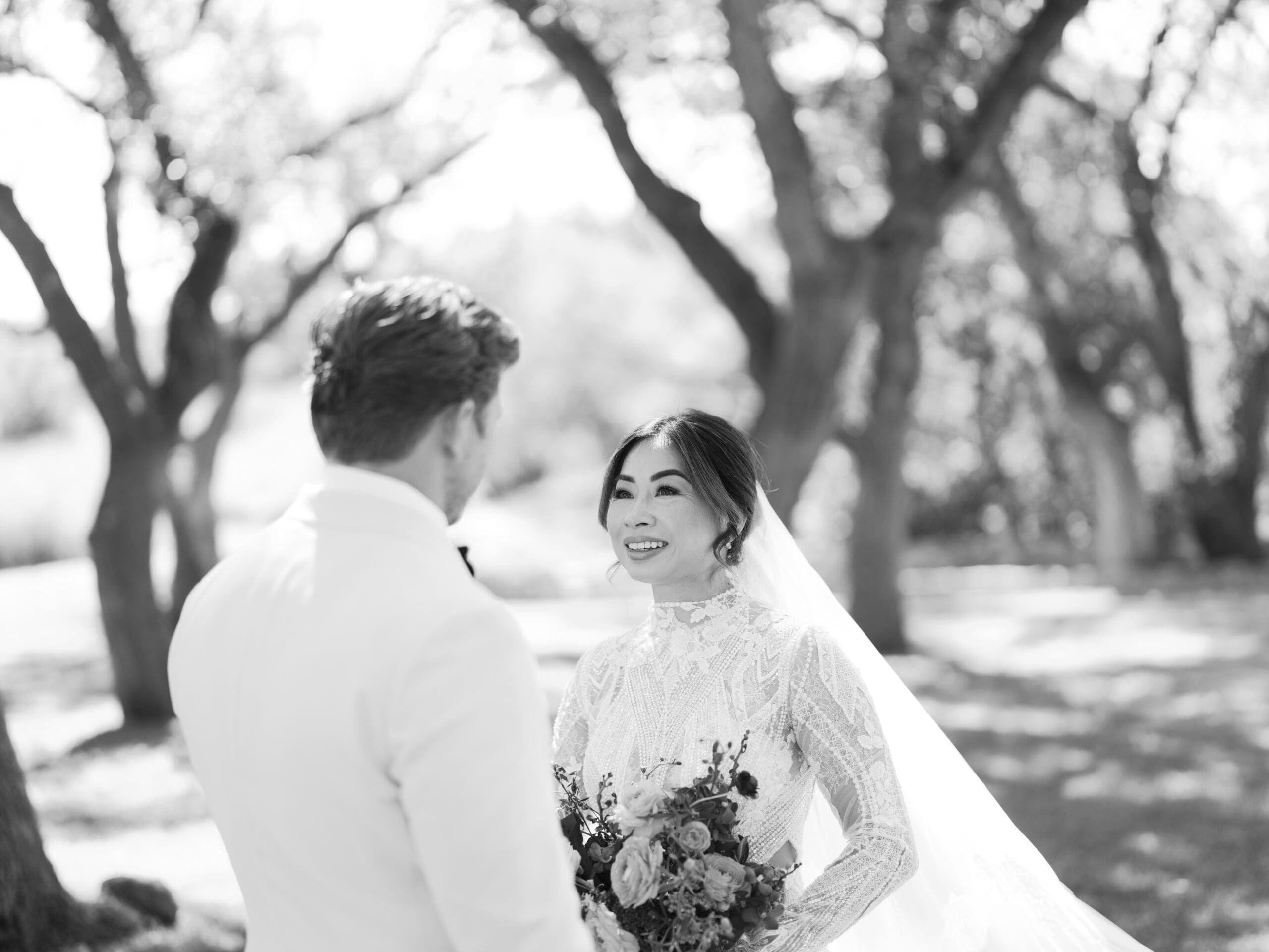 Romantic portrait of Oanh and Jeremy under the oak trees at The Addison Grove, captured on film