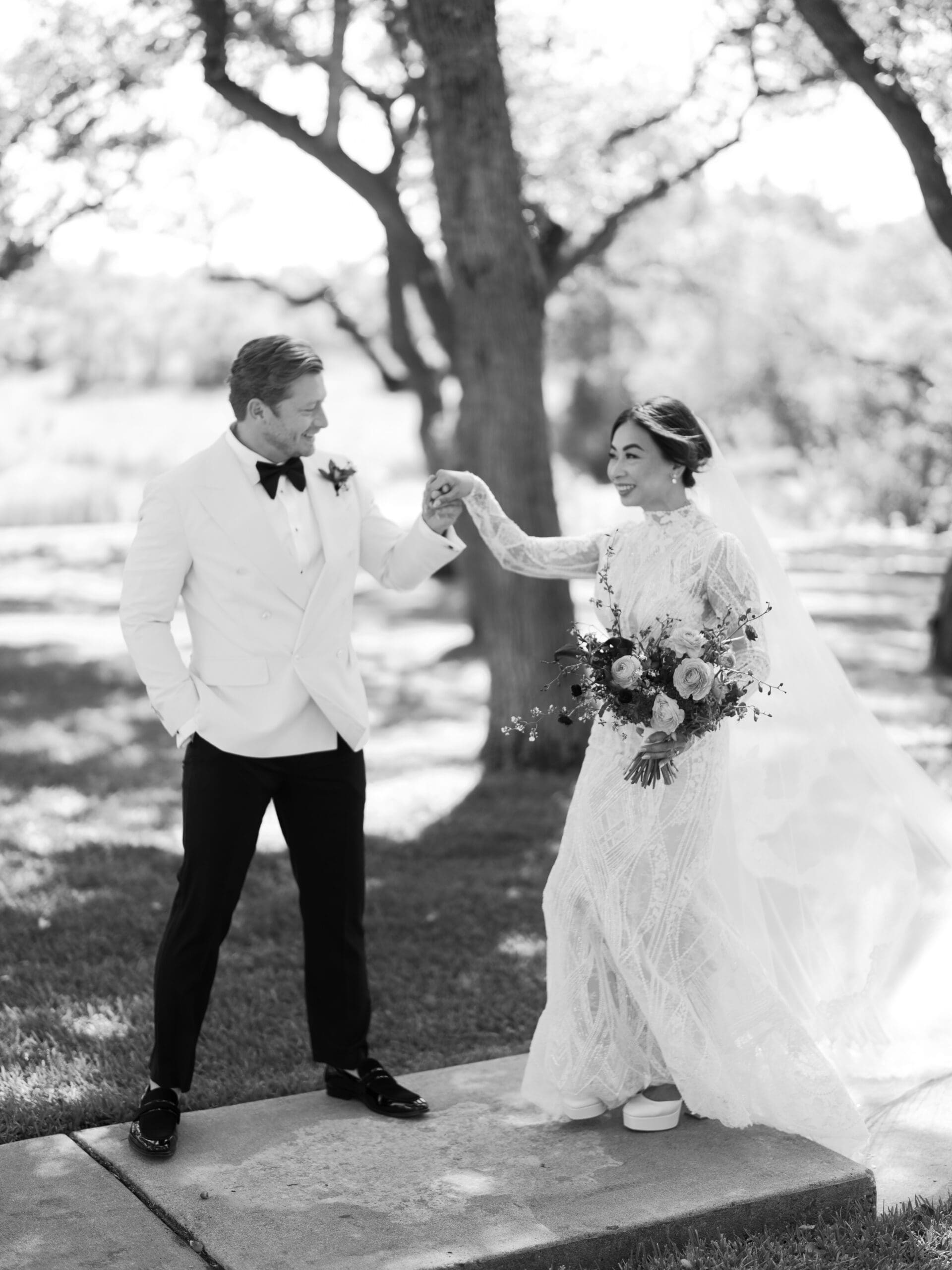 Romantic portrait of Oanh and Jeremy under the oak trees at The Addison Grove, captured on film