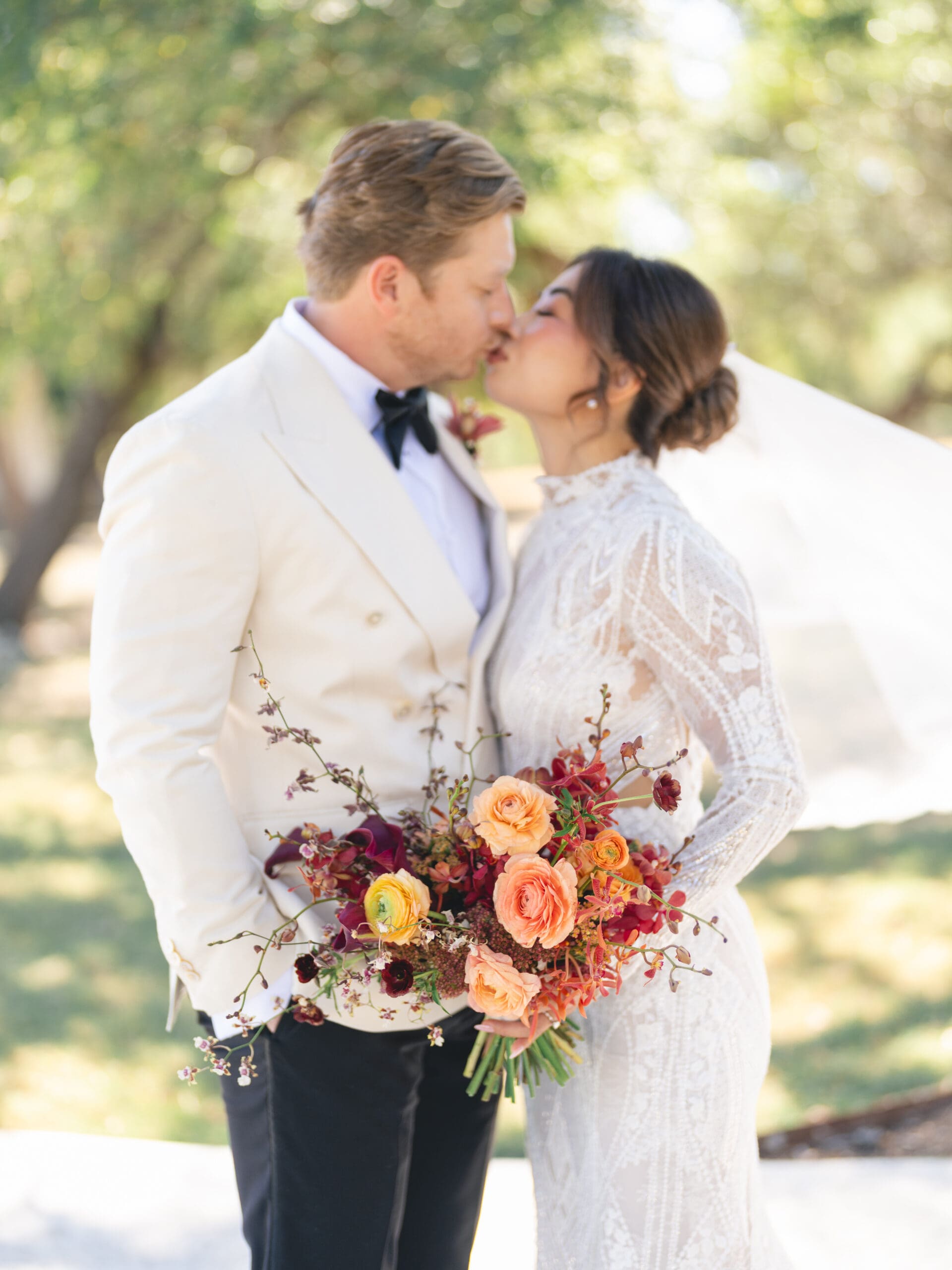 Romantic portrait of Oanh and Jeremy under the oak trees at The Addison Grove, captured on film