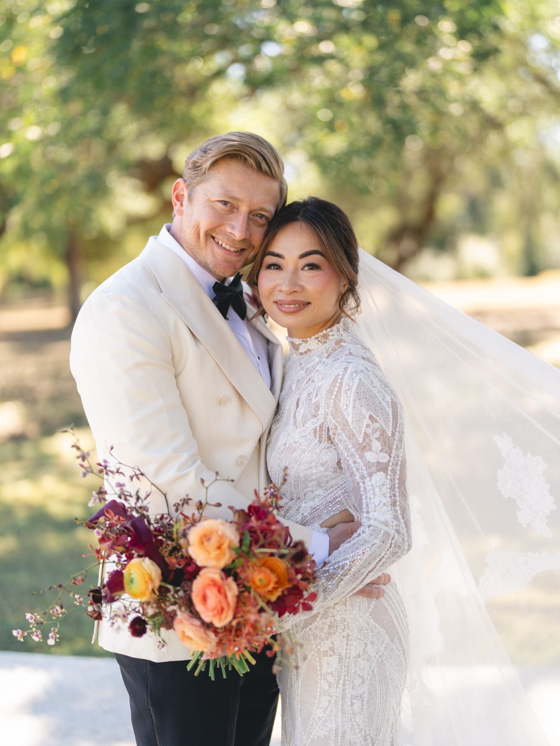 Romantic portrait of Oanh and Jeremy under the oak trees at The Addison Grove, captured on film