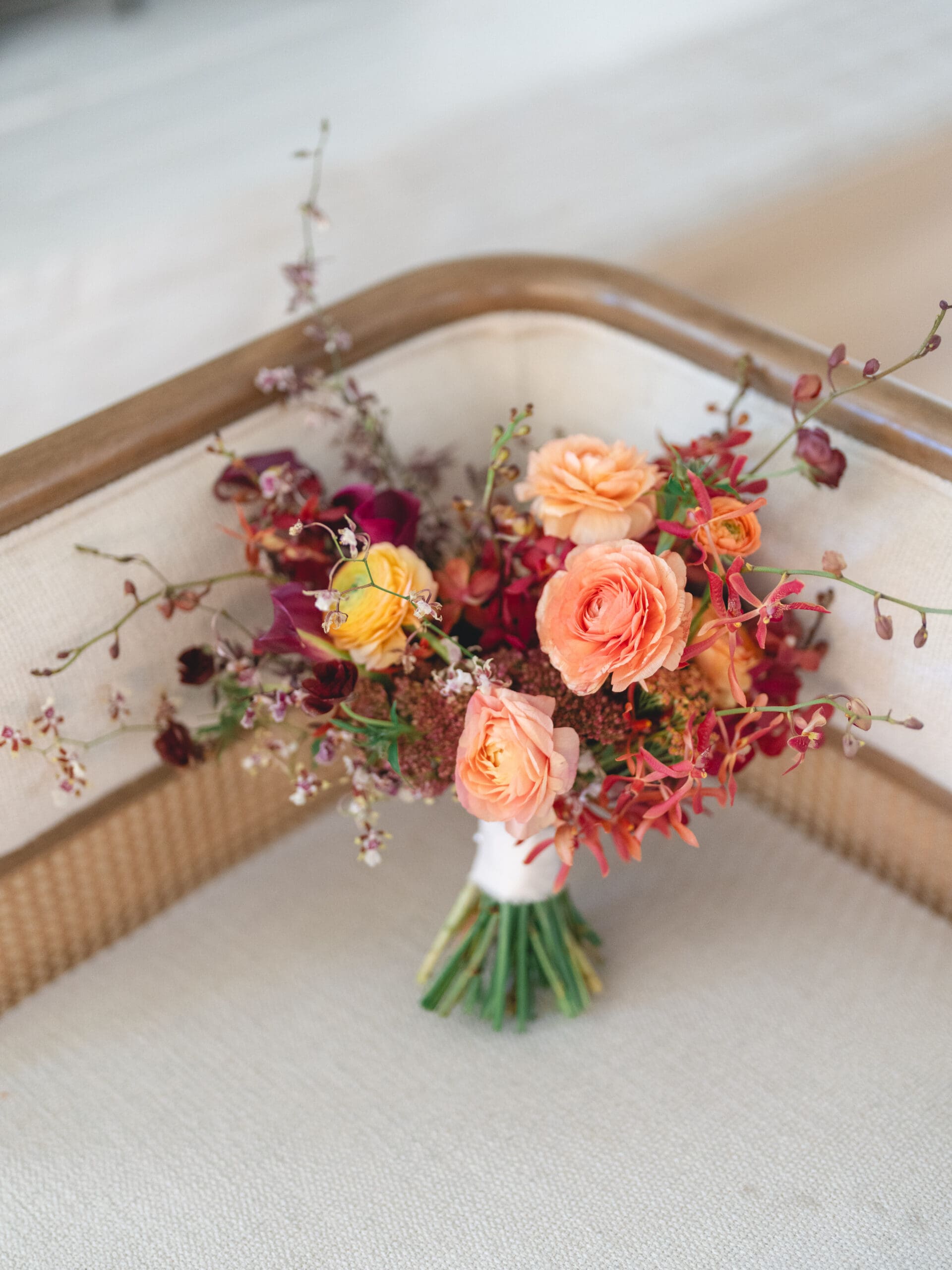 Detail photo of invitation suite, rings, and florals from Oanh and Jeremy’s Addison Grove wedding captured by Paige Vaughn Photo