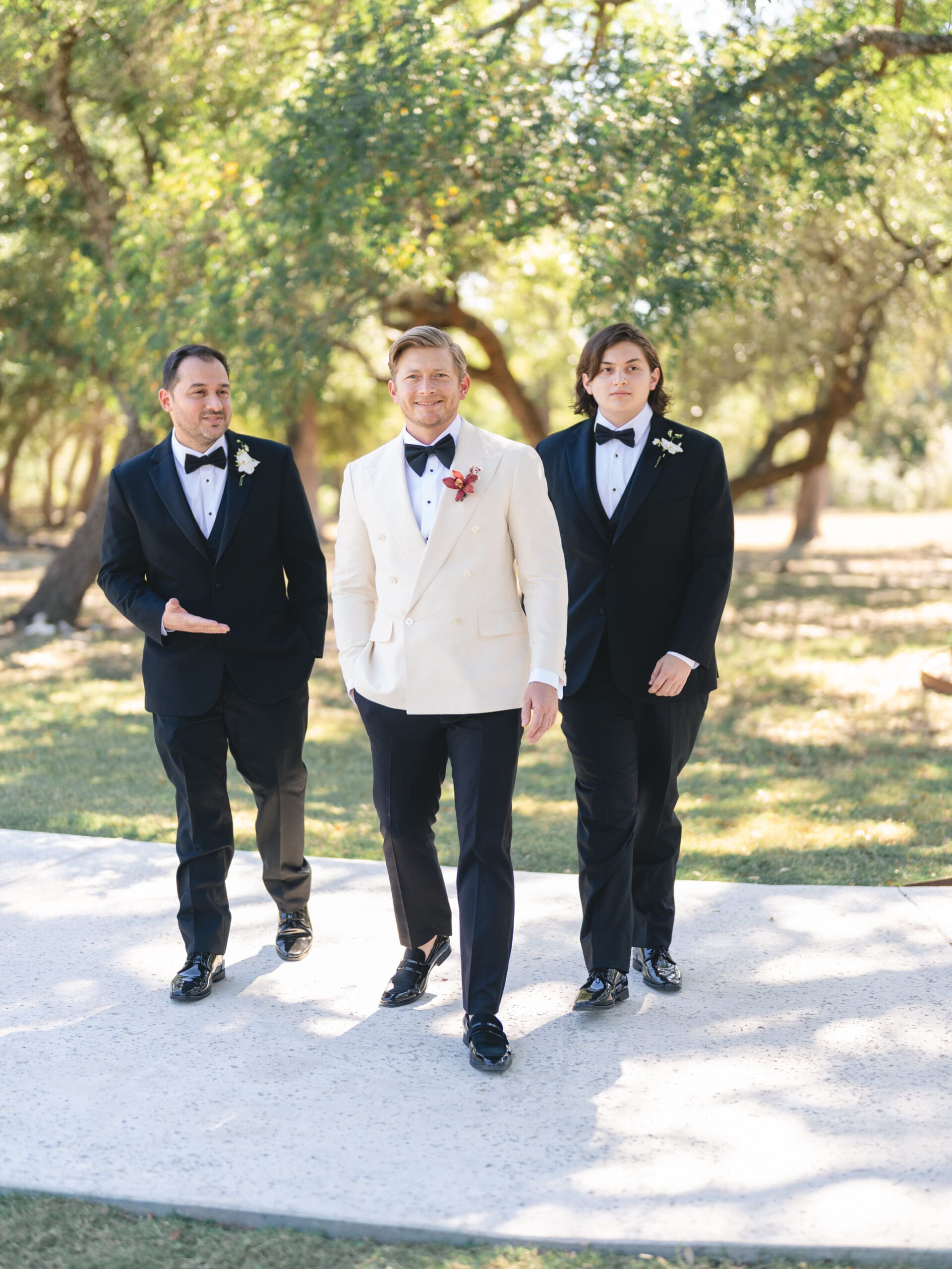 groom adjusting his boutonniere before the ceremony at The Addison Grove wedding in Austin, TX