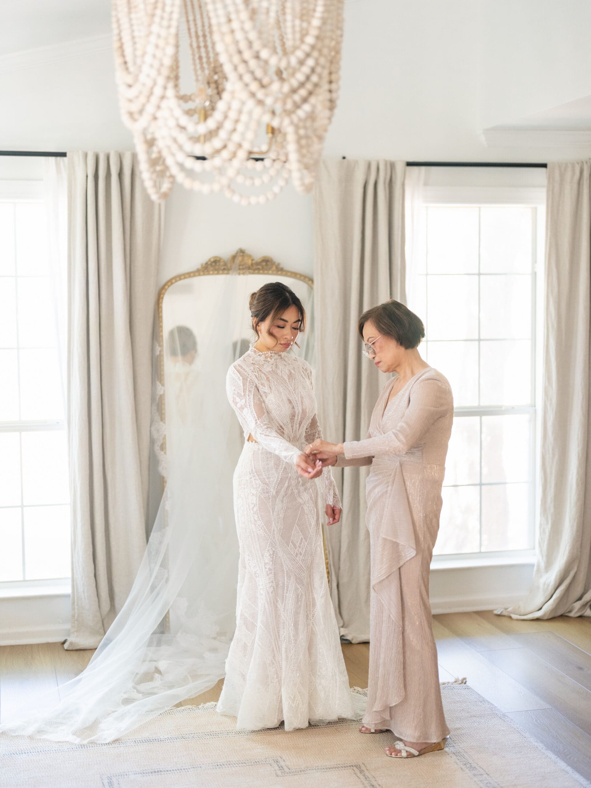 Bride getting ready in the bridal suite at The Addison Grove, joyful candid moments and soft natural light