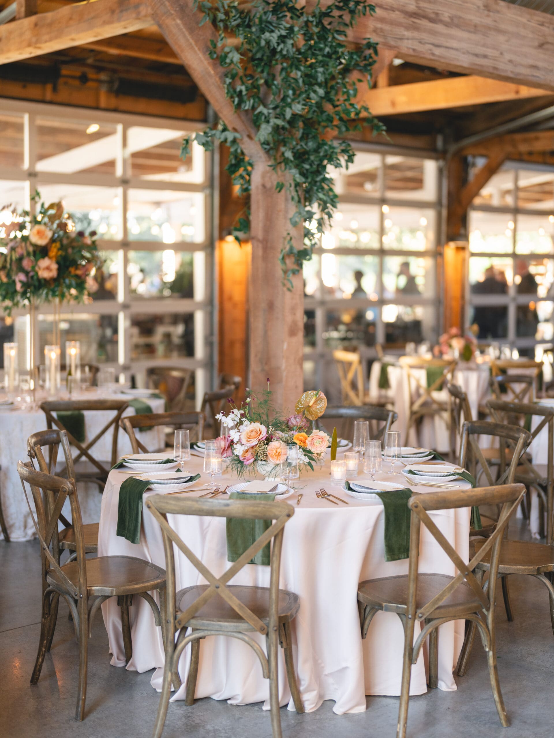 Reception details with floral centerpieces, candlelight, and elegant table settings at The Addison Grove