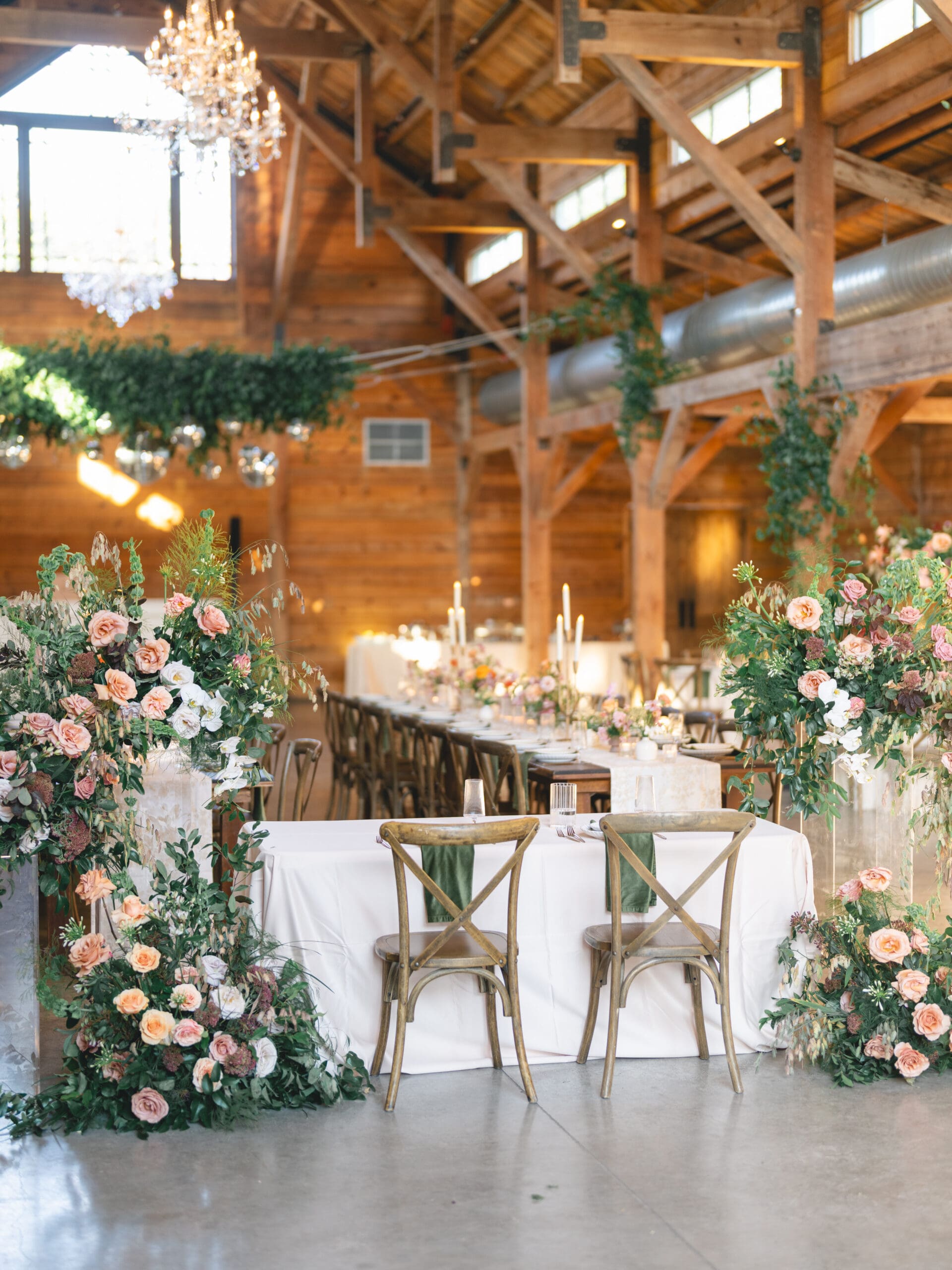 Reception details with floral centerpieces, candlelight, and elegant table settings at The Addison Grove