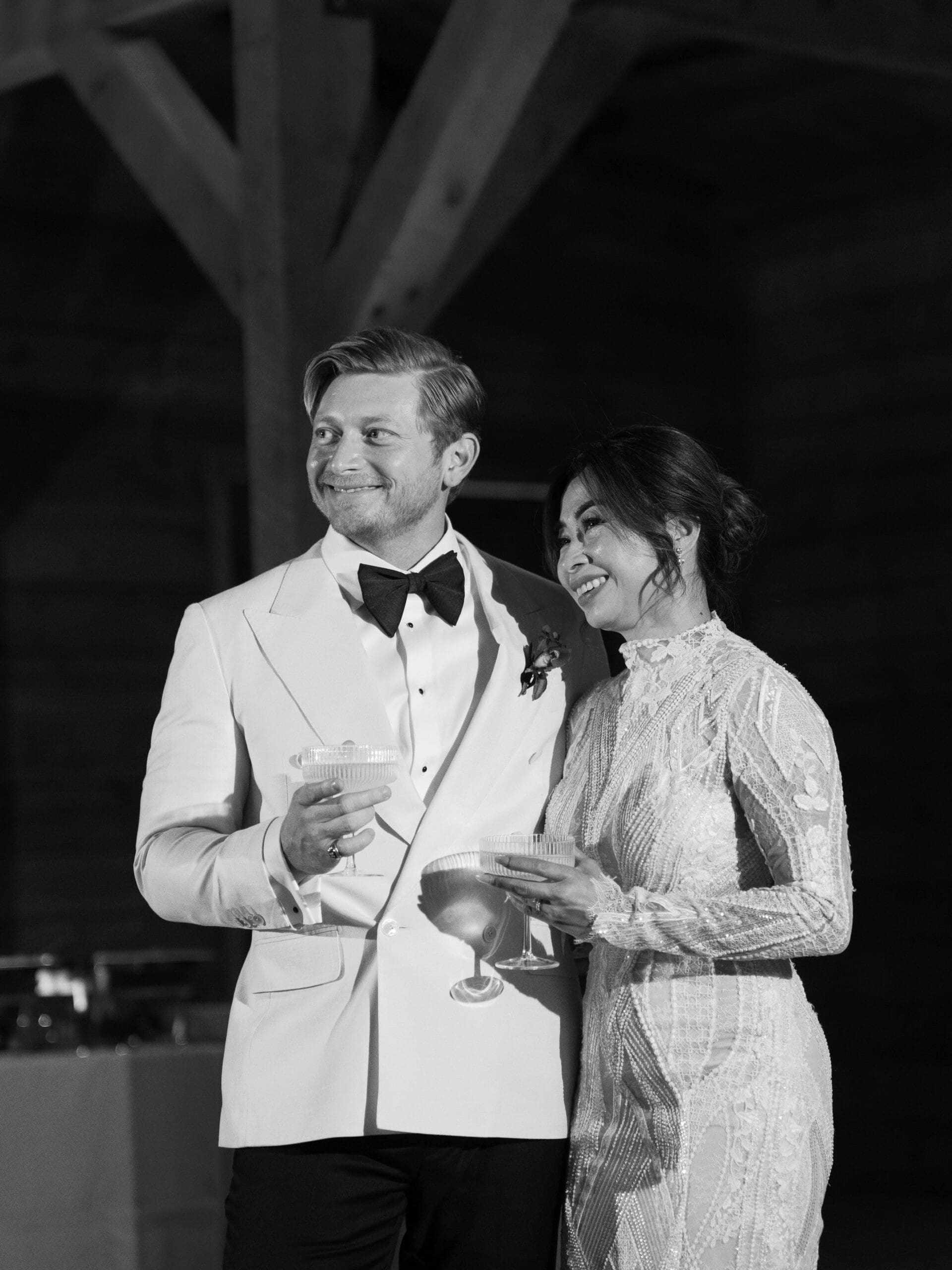 First dance moment of Oanh and Jeremy in the barn at The Addison Grove surrounded by friends and family
