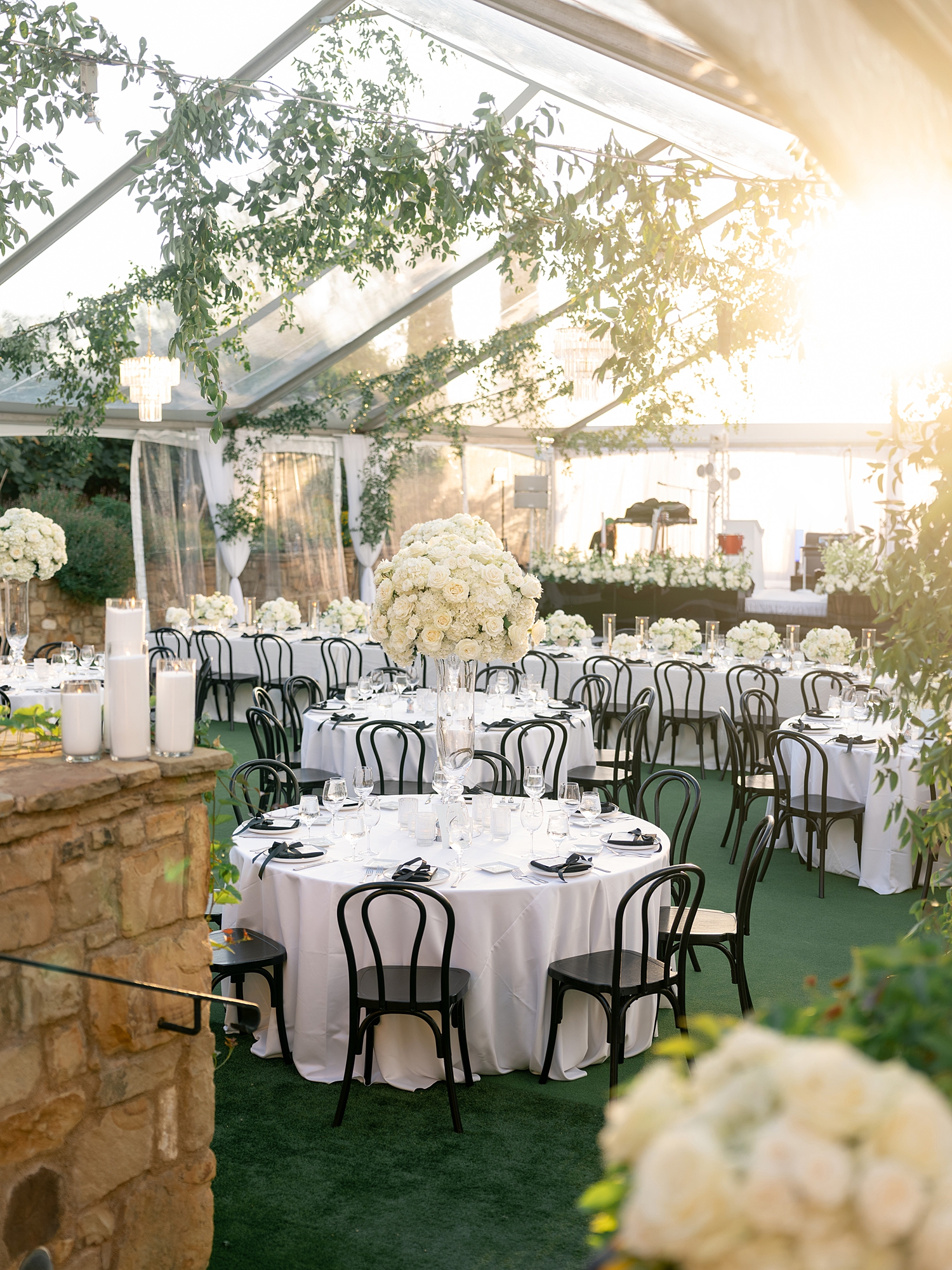Reception tablescape with elegant linens, florals and candles at Escondido Golf Club