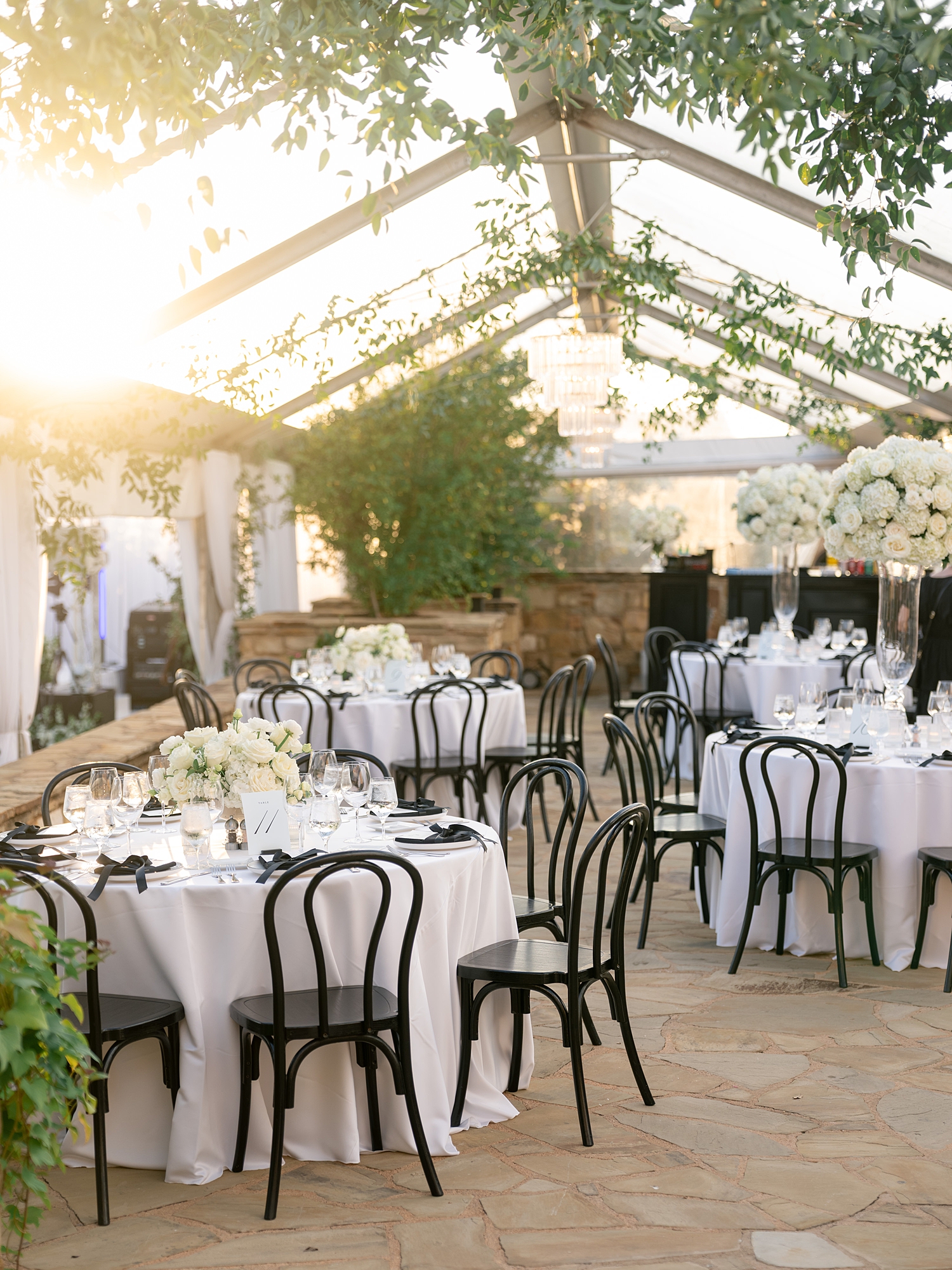 Reception tablescape with elegant linens, florals and candles at Escondido Golf Club