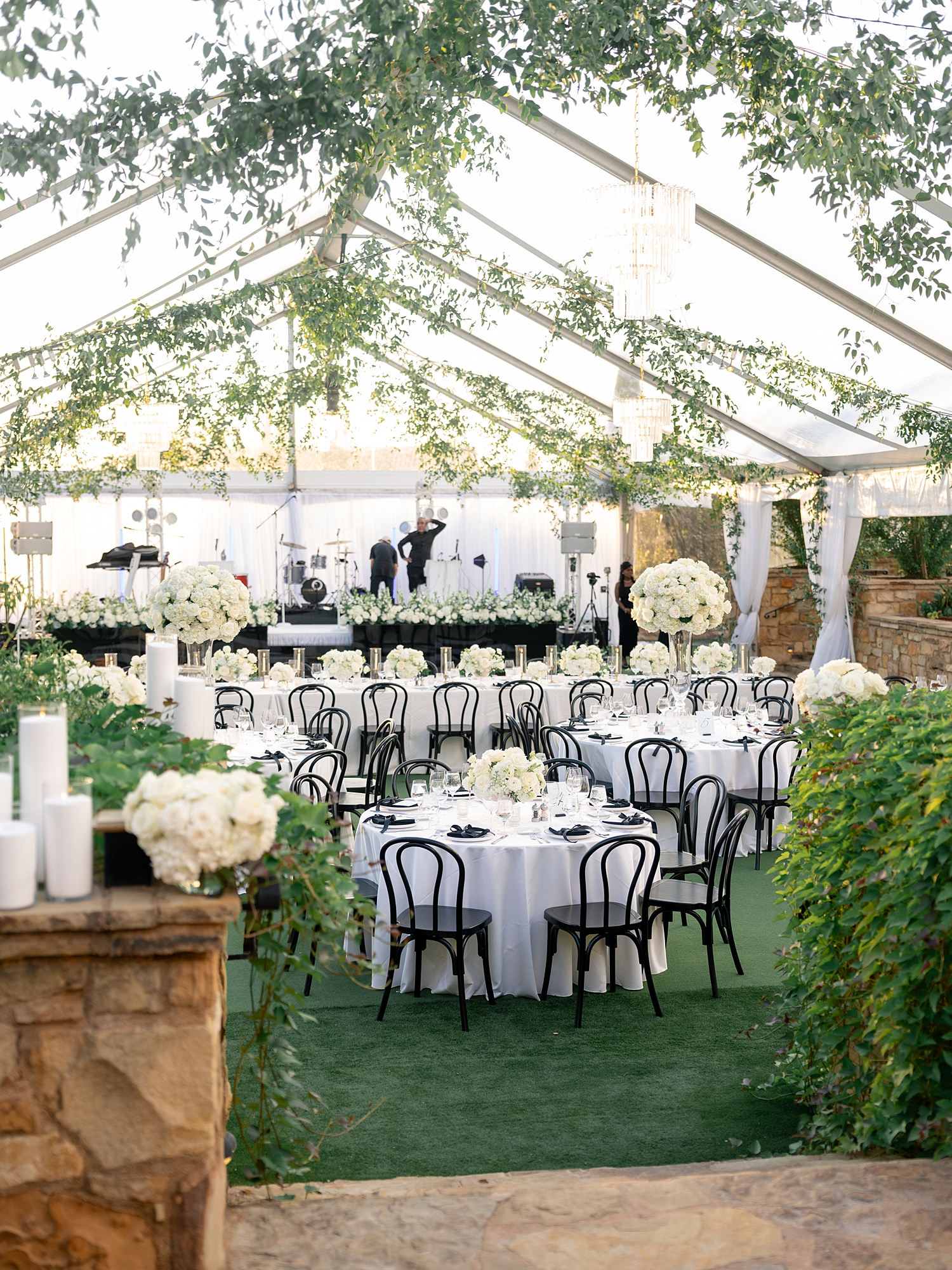 Reception tablescape with elegant linens, florals and candles at Escondido Golf Club