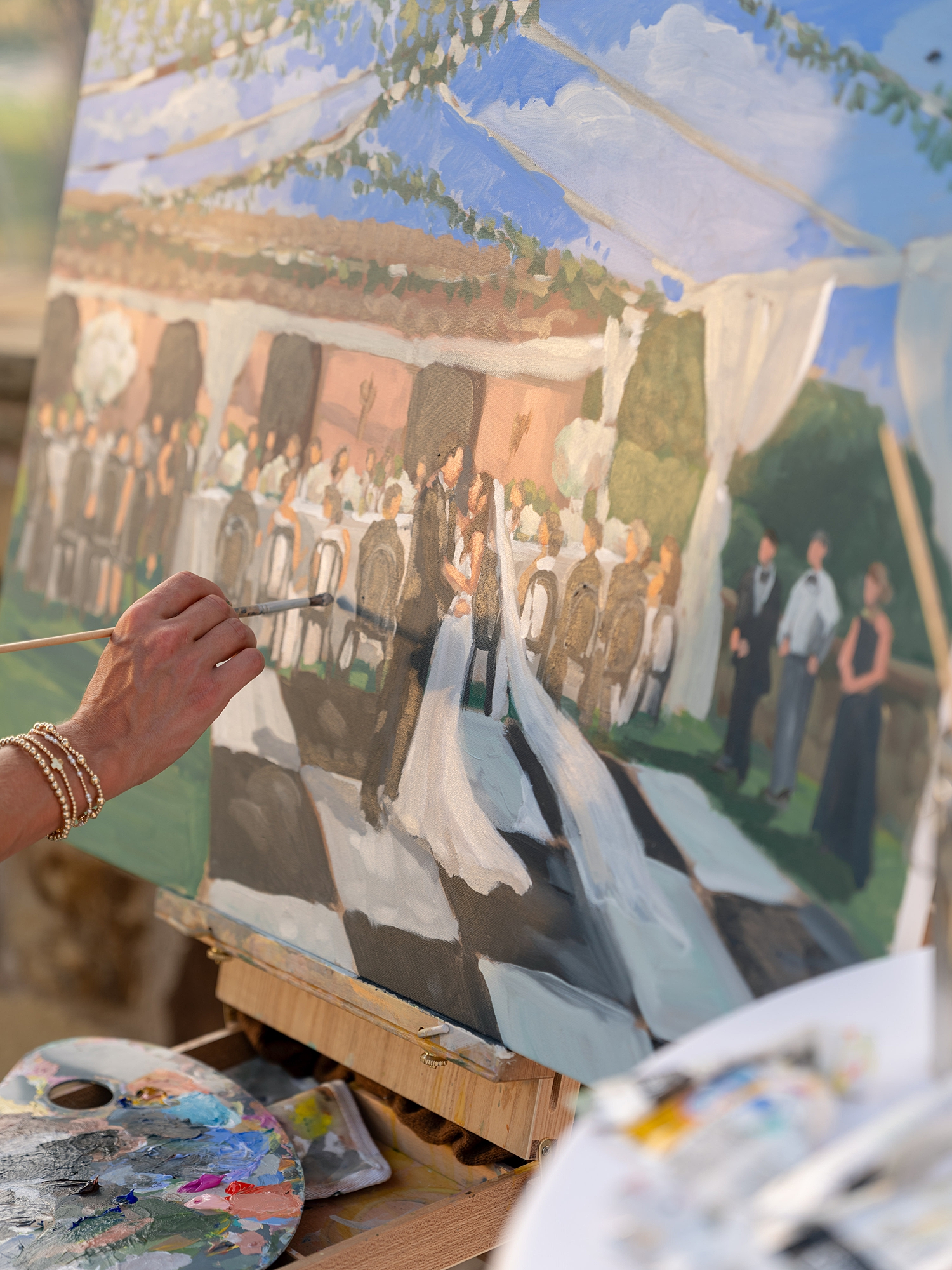 Couple’s first dance under string lights at Escondido Golf Club, vibrant film photography, live painting
