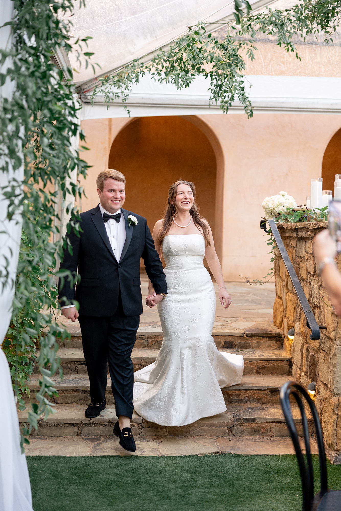 Reception tablescape with elegant linens, florals and candles at Escondido Golf Club