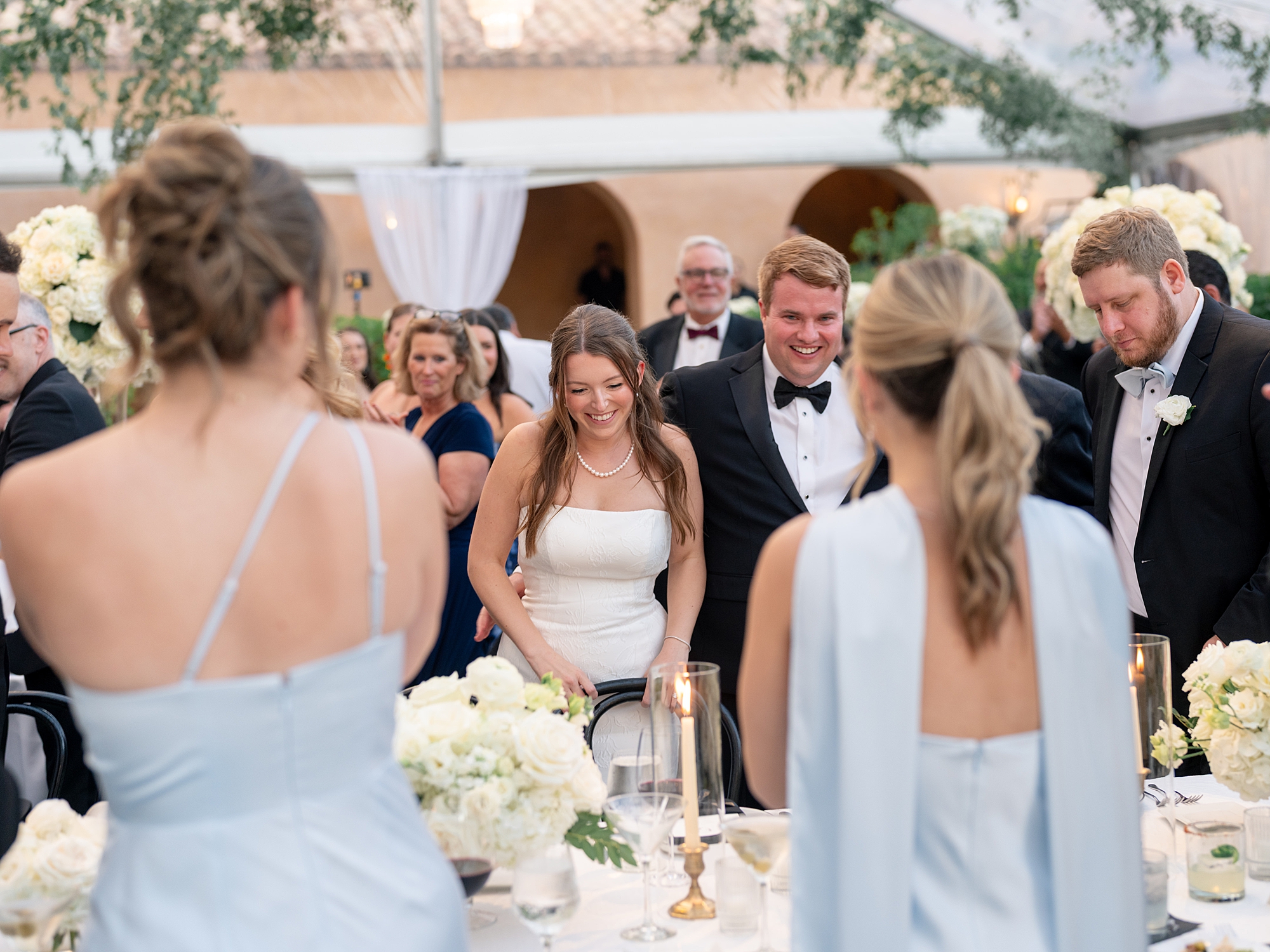wedding guests dancing and celebrating at Escondido Golf Club wedding by Paige Vaughn Photo