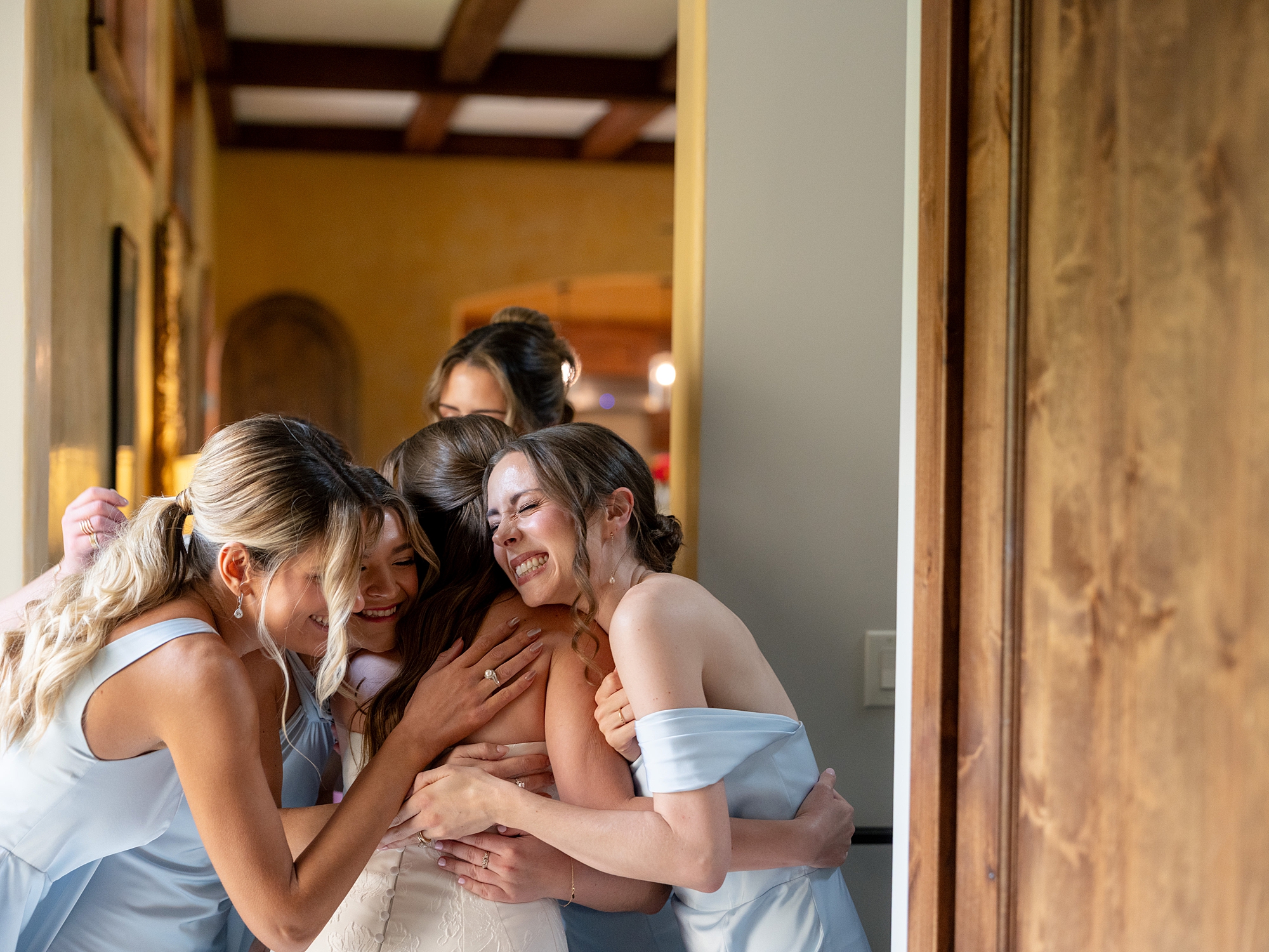 Bridal party getting ready in a sun-lit suite at Escondido Golf Club, captured on film