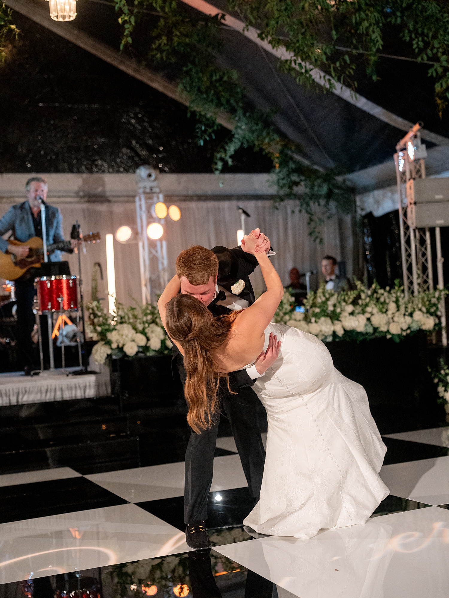 Couple’s first dance under string lights at Escondido Golf Club, vibrant film photography