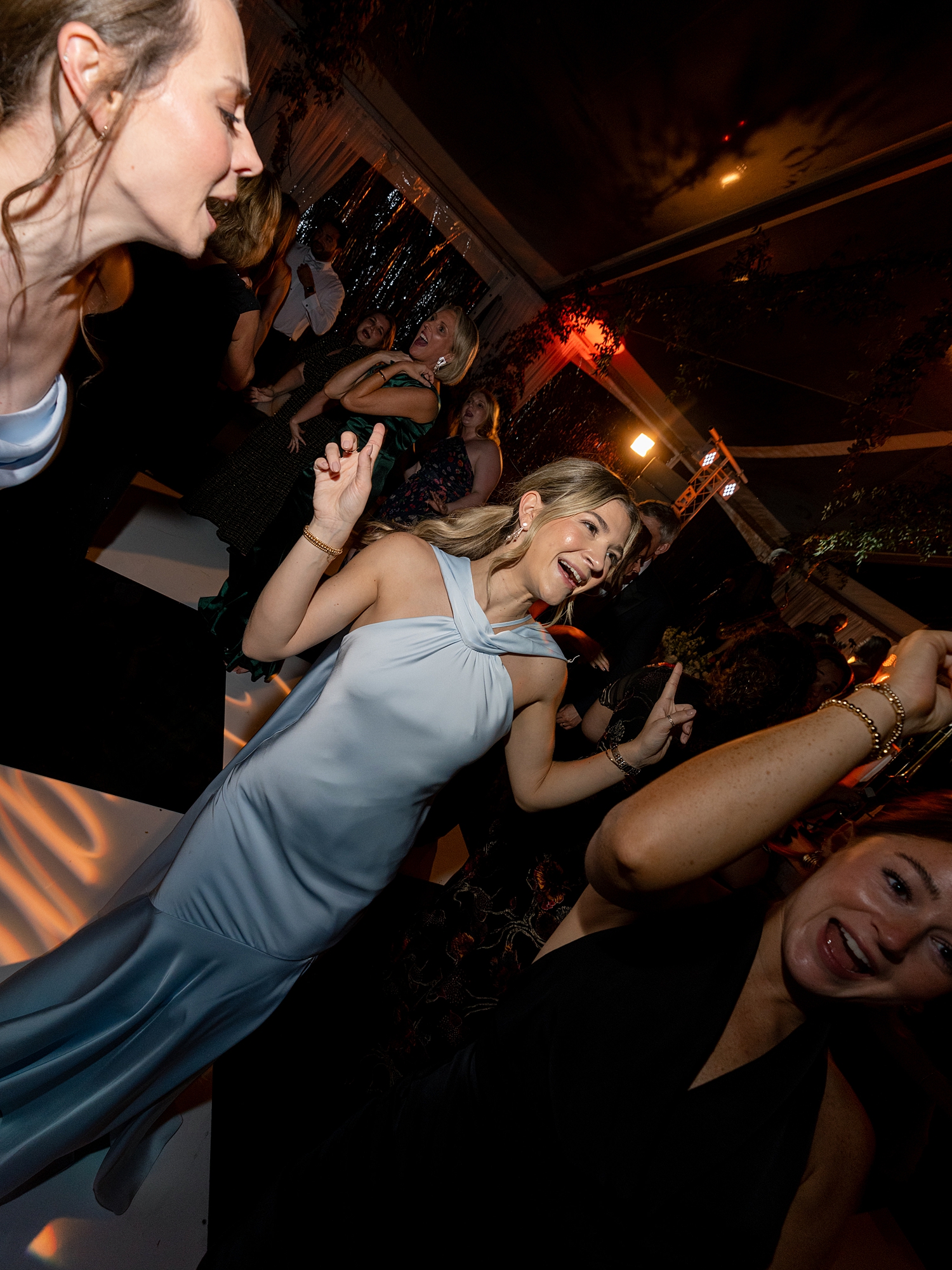 wedding guests dancing and celebrating on the dance floor at Escondido Golf Club wedding by Paige Vaughn Photo