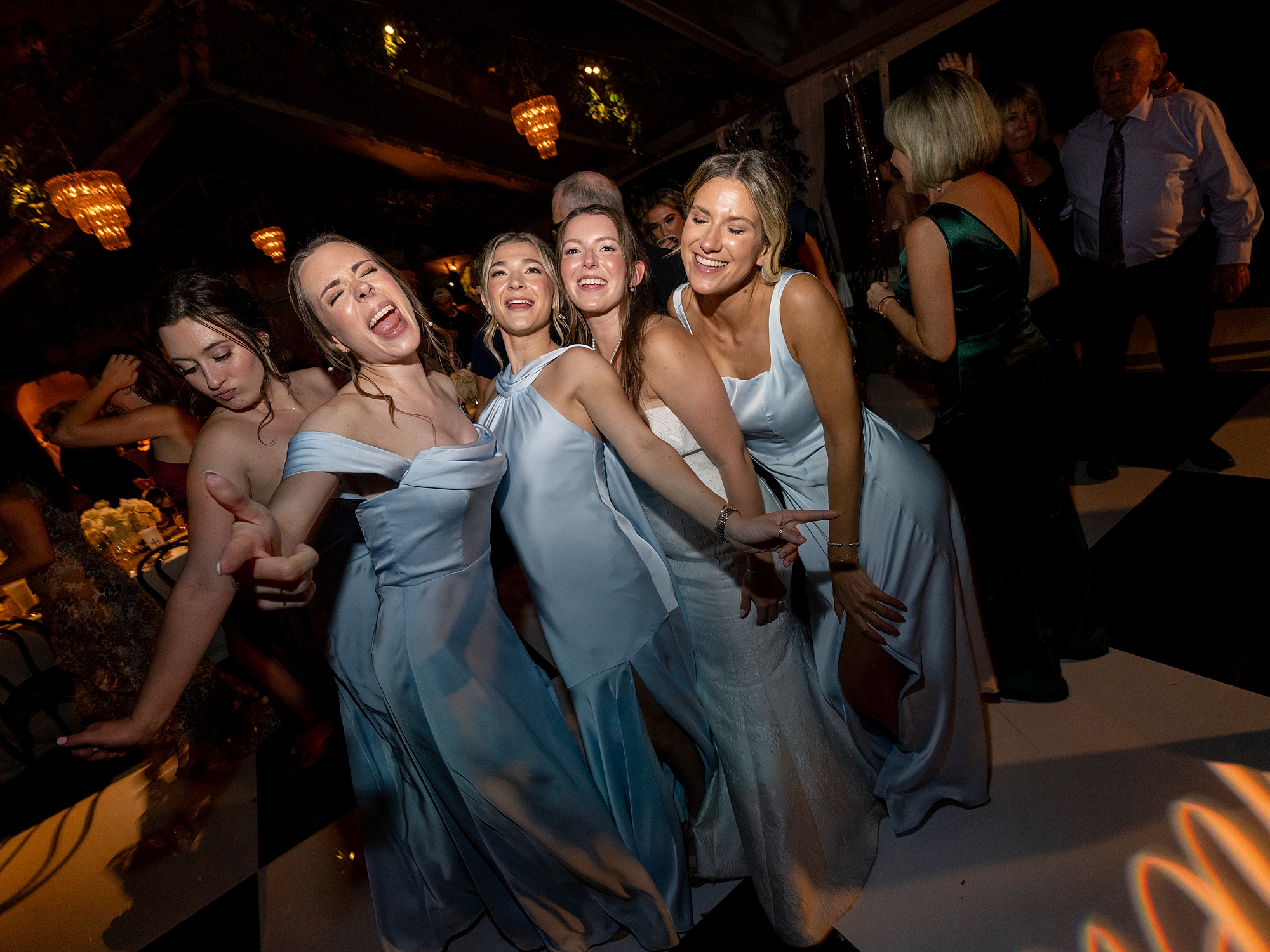 wedding guests dancing and celebrating on the dance floor at Escondido Golf Club wedding by Paige Vaughn Photo