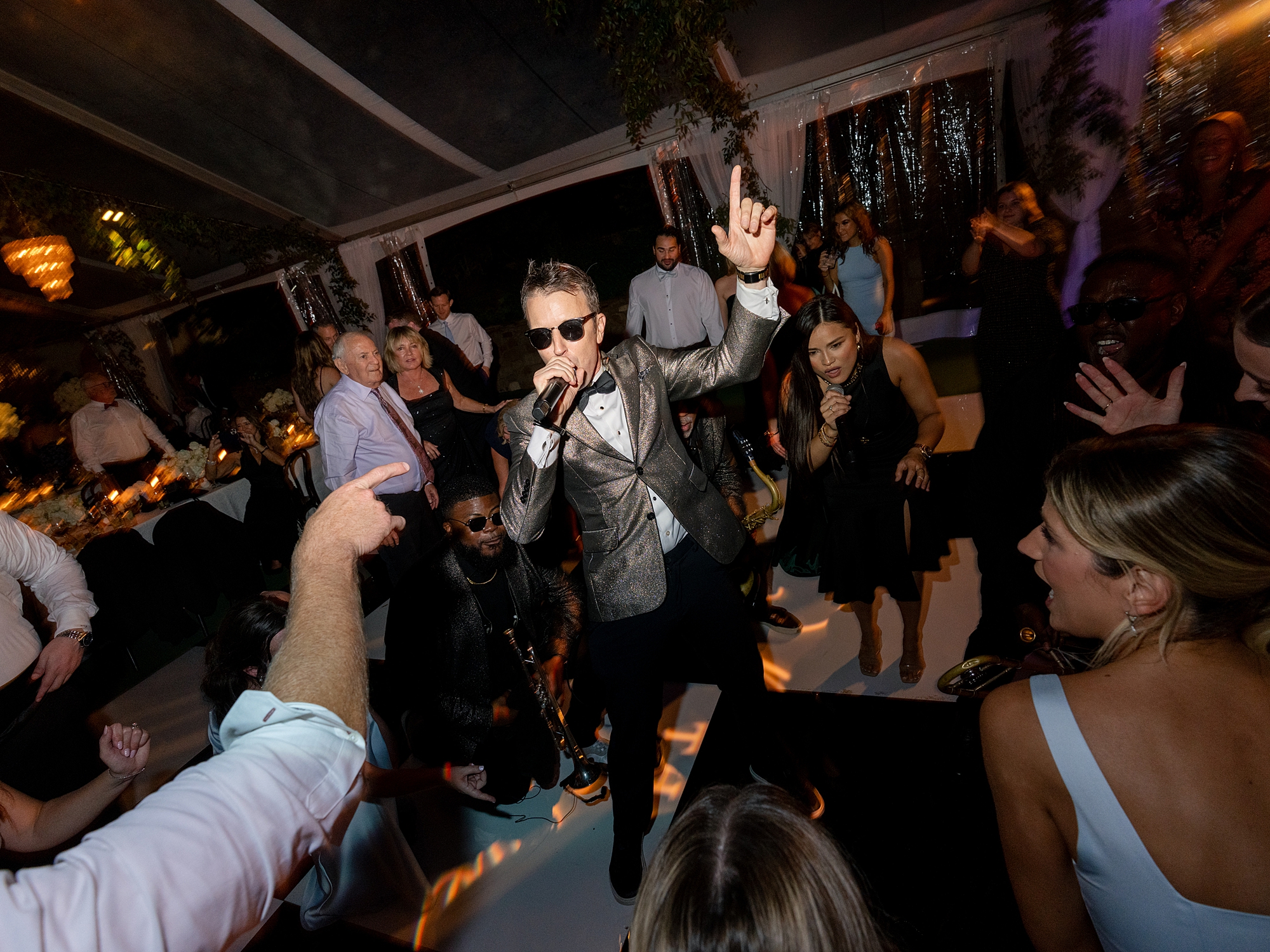 wedding guests dancing and celebrating on the dance floor at Escondido Golf Club wedding by Paige Vaughn Photo