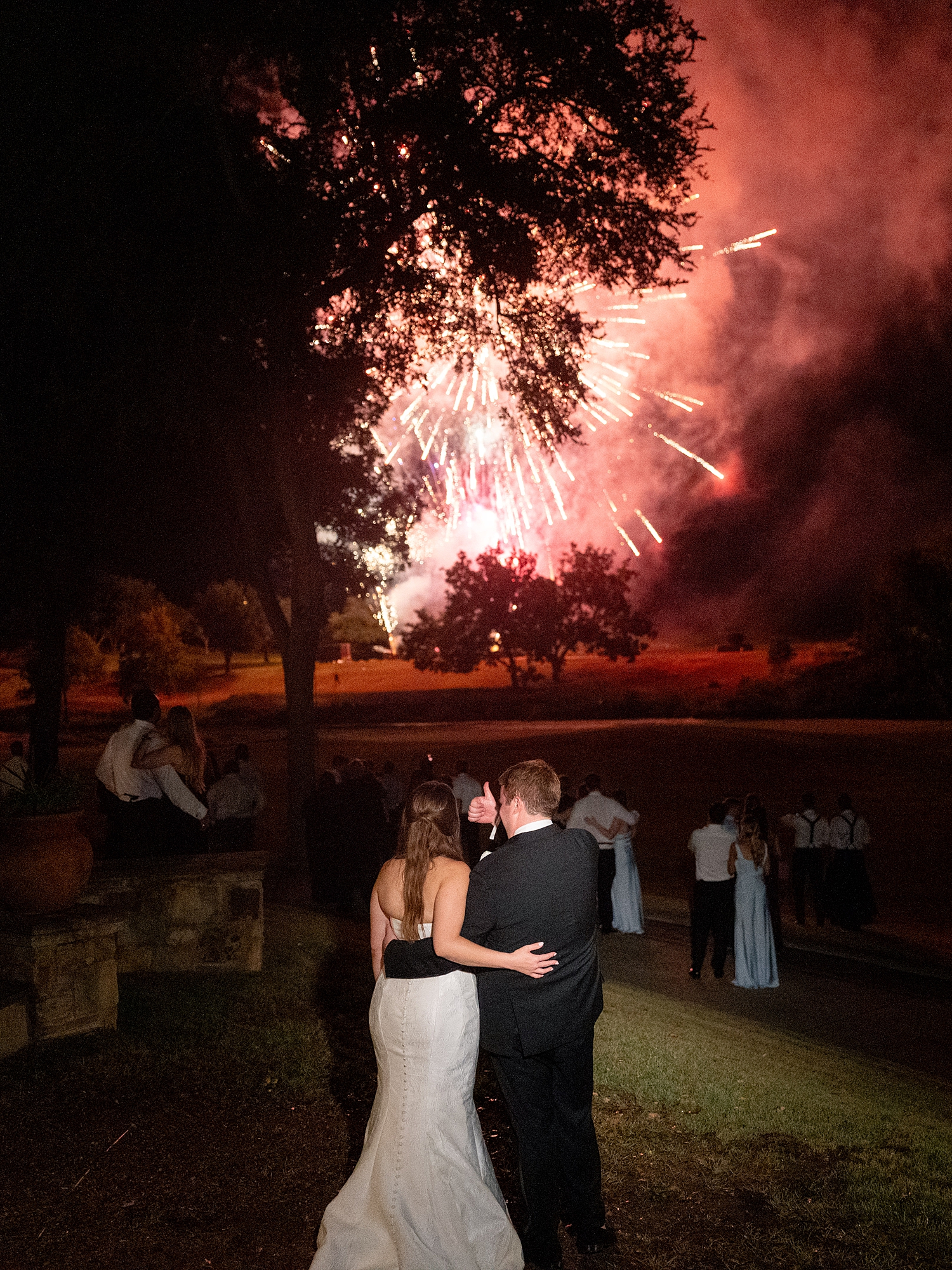 Nighttime exit of bride and groom amidst fireworks at Escondido Golf Club, Texas wedding inspiration