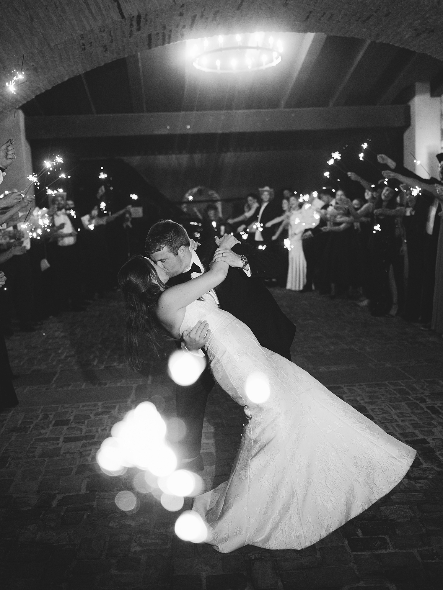 Nighttime exit of bride and groom amidst sparkler send-off at Escondido Golf Club, Texas wedding inspiration