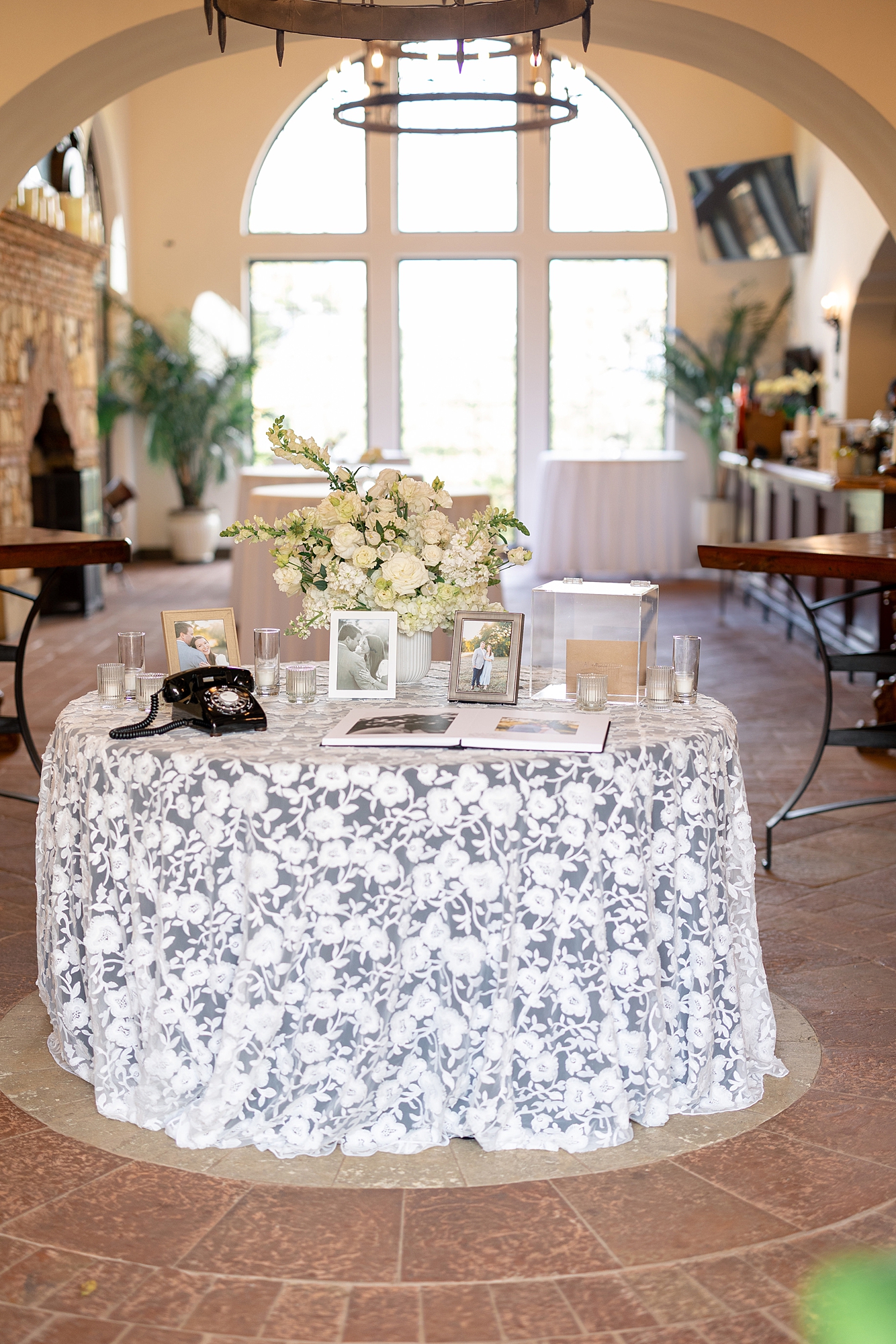 Reception tablescape with elegant linens, florals and candles at Escondido Golf Club