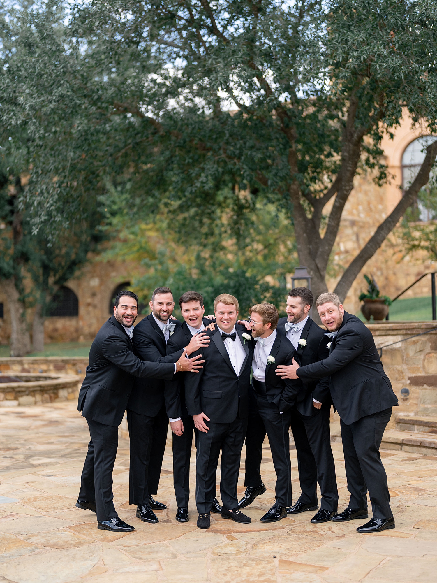joyful wedding party portrait at Escondido Golf Club, Austin wedding photography by Paige Vaughn Photo