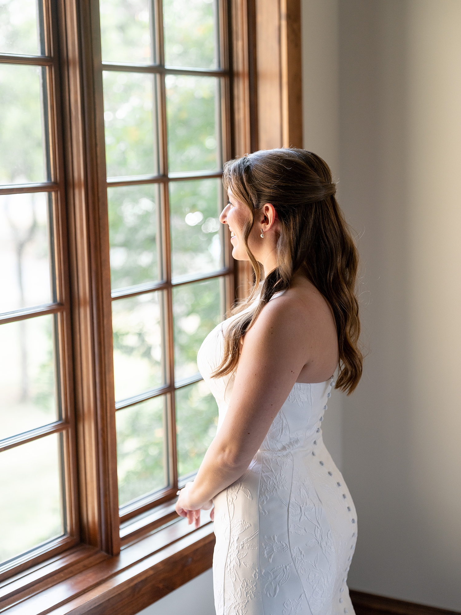 Bridal party getting ready in a sun-lit suite at Escondido Golf Club, captured on film