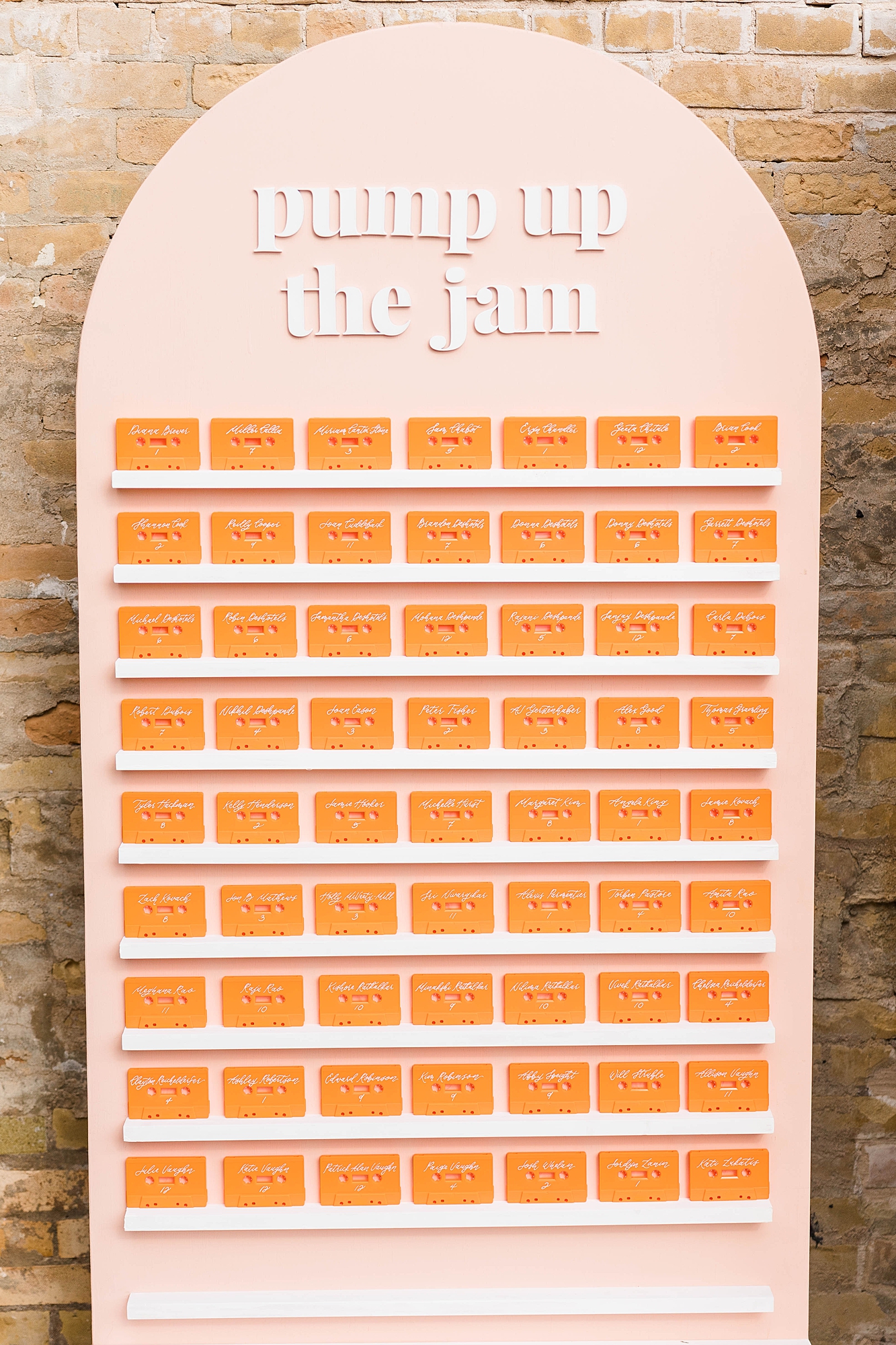 Western reception with retro-inspired decor in peach, mustard, teal and orange, guests dancing under fall light, place setting