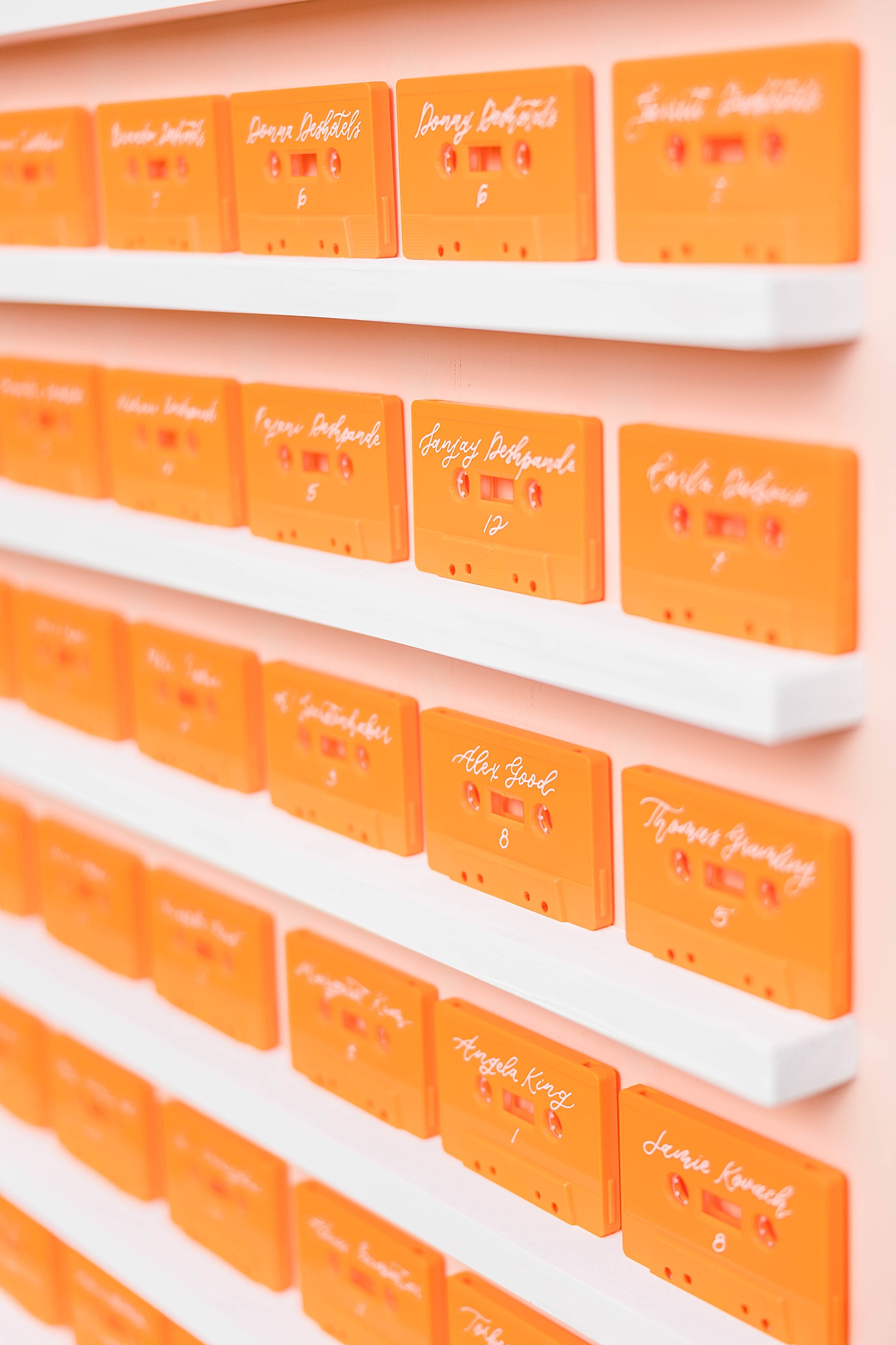 Western reception with retro-inspired decor in peach, mustard, teal and orange, guests dancing under fall light