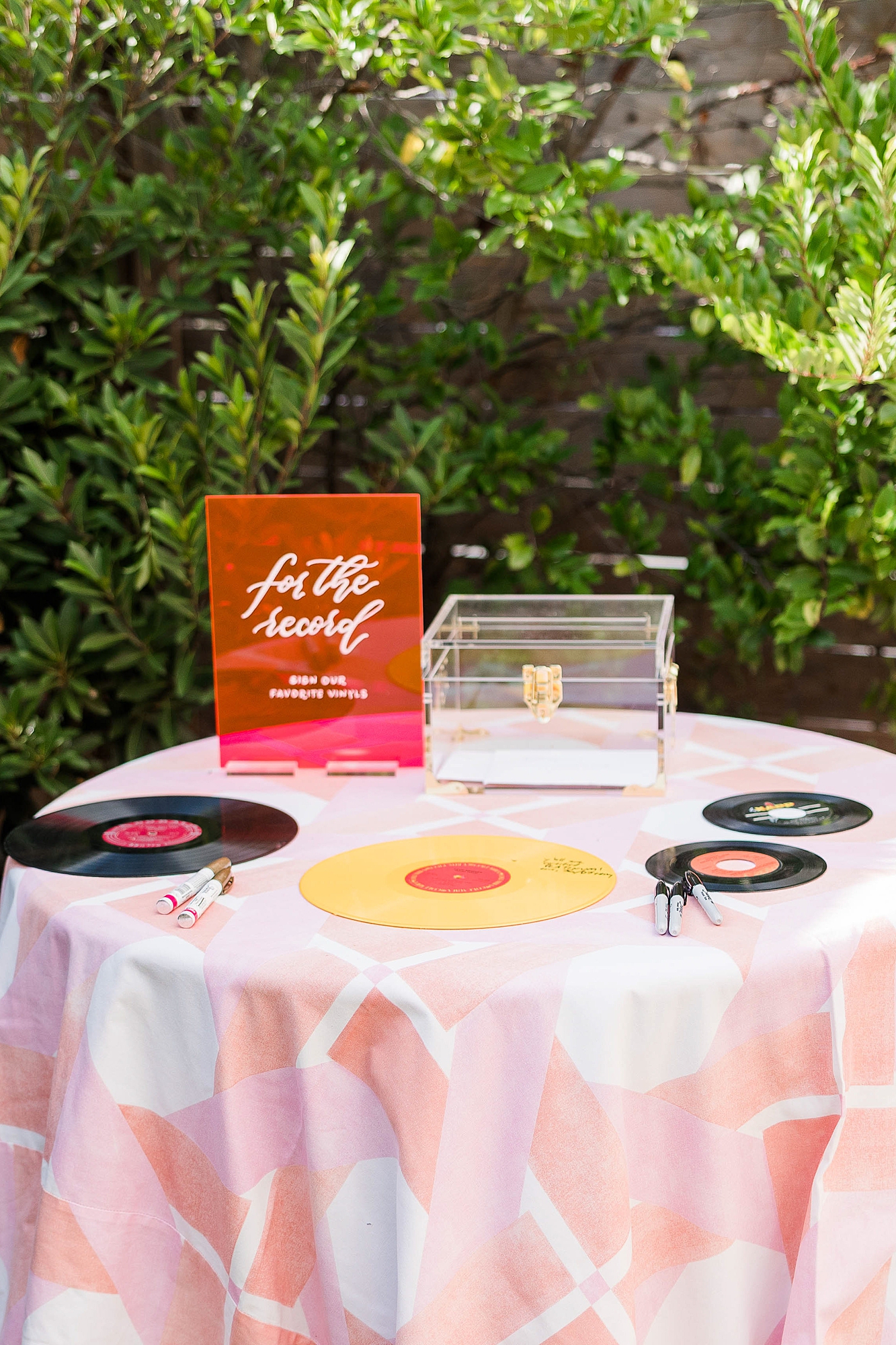 Western reception with retro-inspired decor in peach, mustard, teal and orange, guests dancing under fall light
