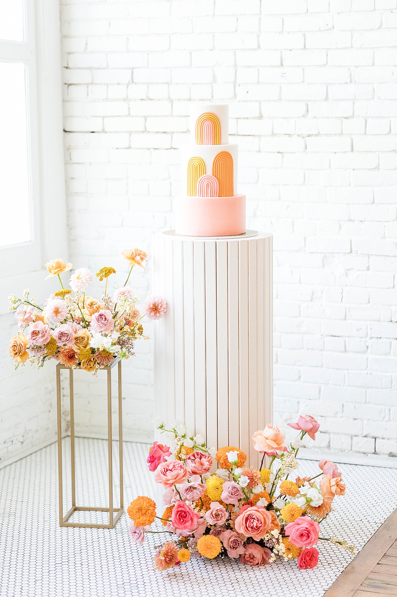 Western reception with retro-inspired decor in peach, mustard, teal and orange, guests dancing under fall light