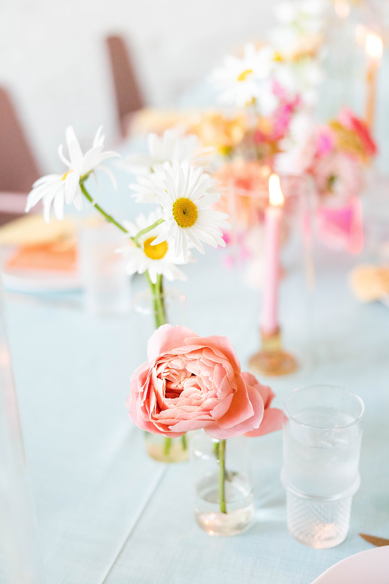 Western reception with retro-inspired decor in peach, mustard, teal and orange, guests dancing under fall light