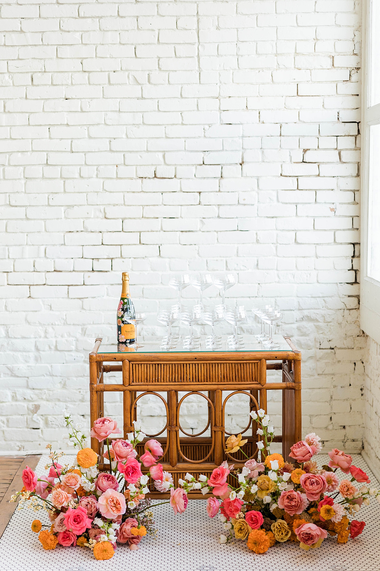 Western reception with retro-inspired decor in peach, mustard, teal and orange, guests dancing under fall light