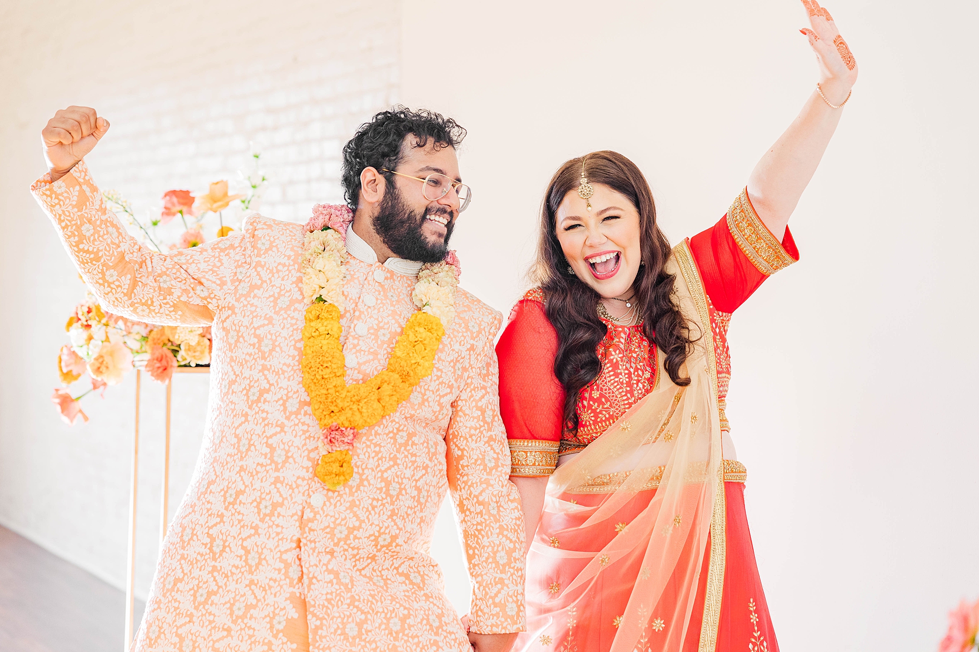 Joyful portrait of bride and groom mid-celebration at their fall wedding weekend in Texas