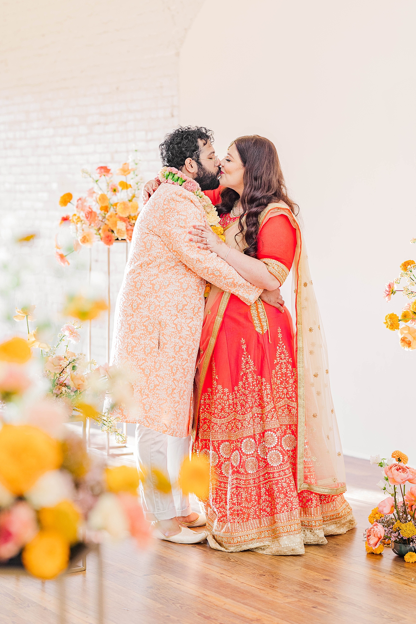 Joyful portrait of bride and groom mid-celebration at their fall wedding weekend in Texas