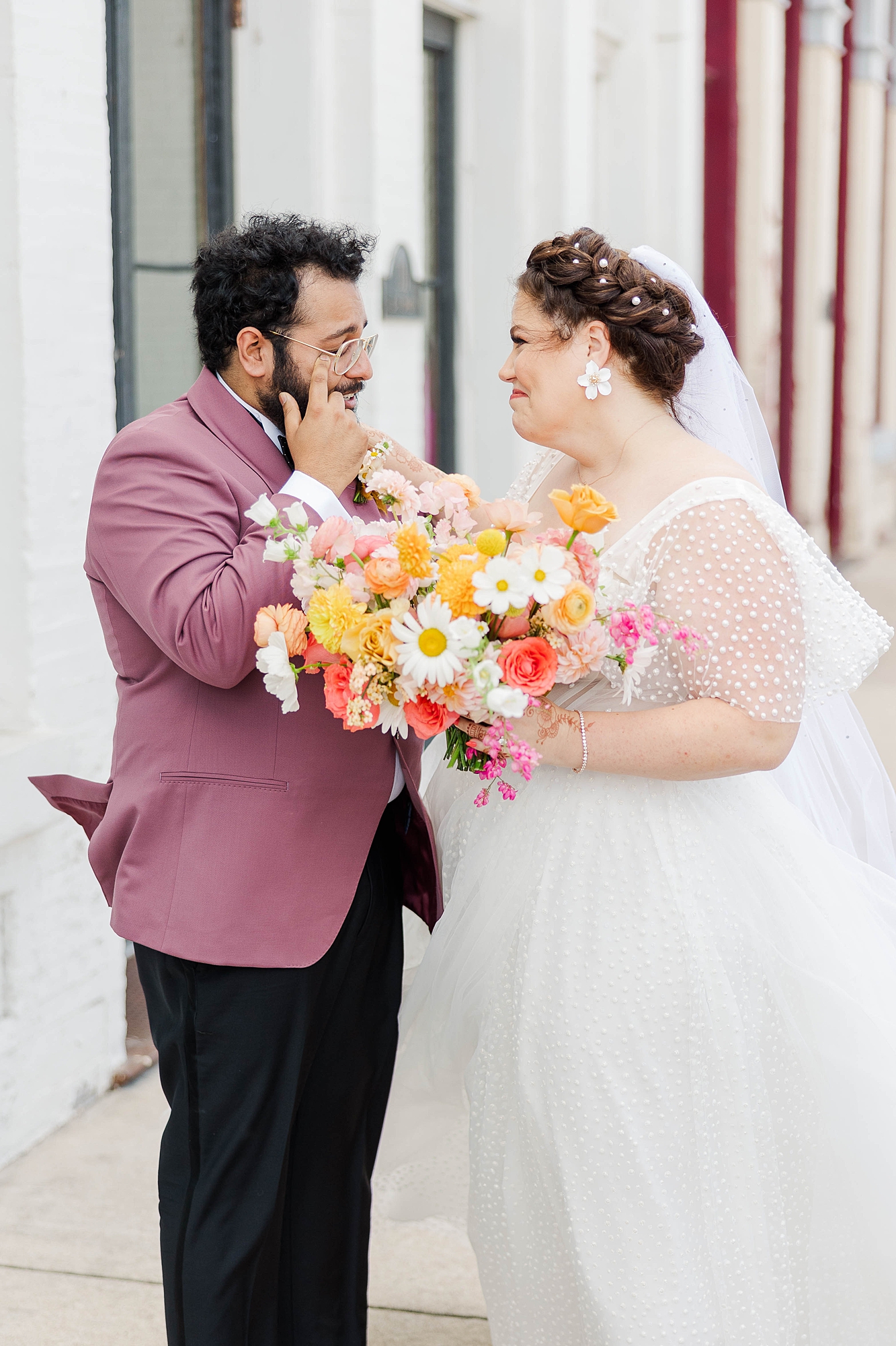 Autumn wedding ceremony with deep jewel tones, fun patterns and joyful family moments, bride and groom first look