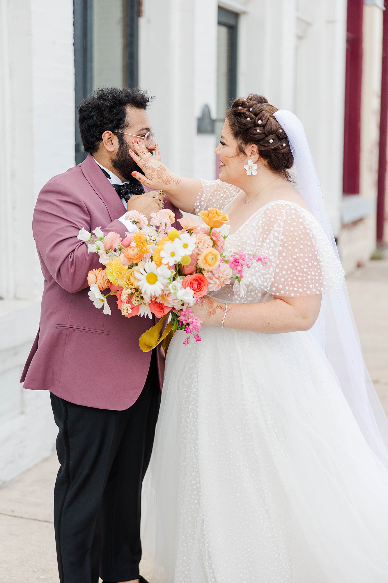 Autumn wedding ceremony with deep jewel tones, fun patterns and joyful family moments, bride and groom first look