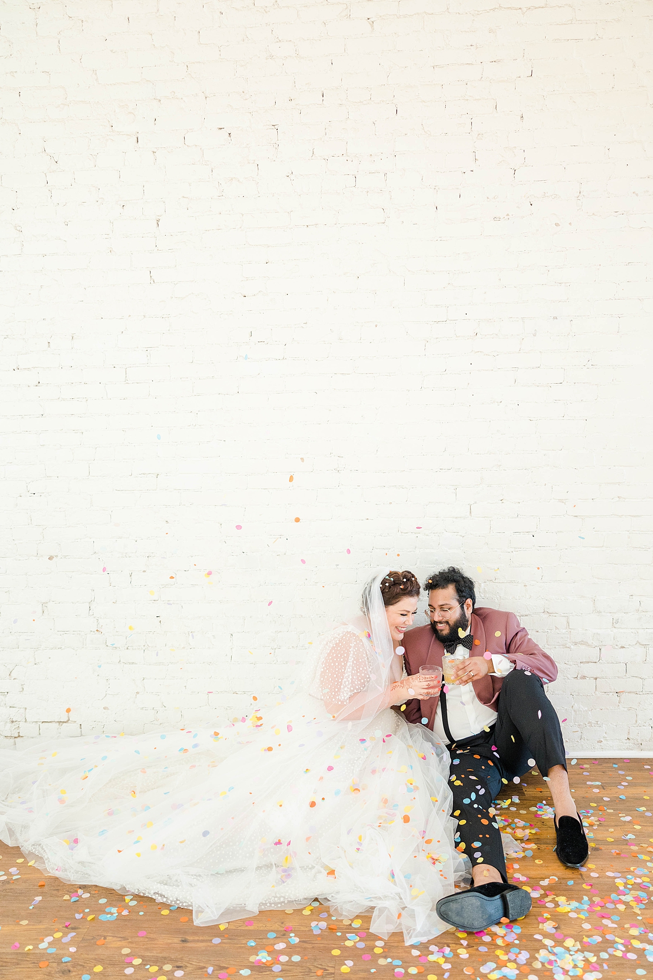 Autumn wedding ceremony with deep jewel tones, fun patterns and joyful family moments, bride and groom portraits