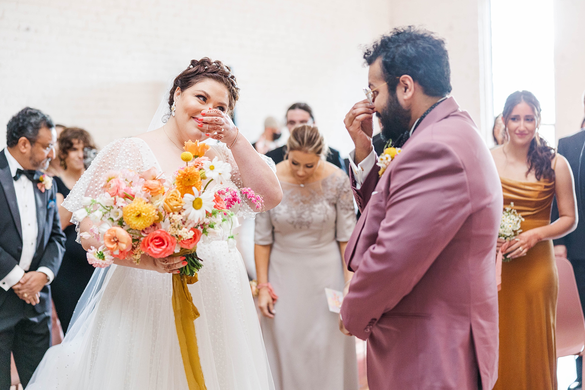Autumn wedding ceremony with deep jewel tones, fun patterns and joyful family moments