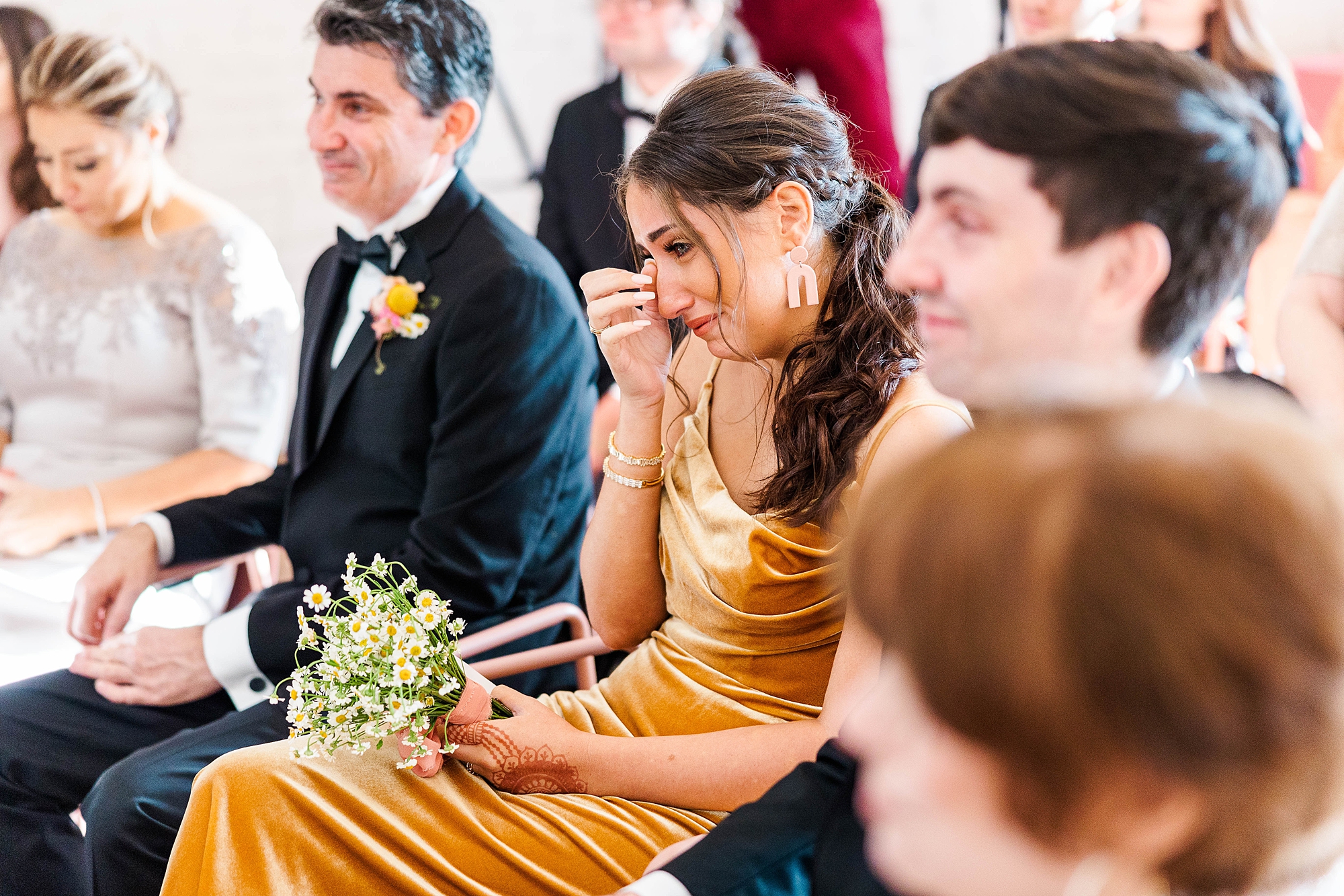 Autumn wedding ceremony with deep jewel tones, fun patterns and joyful family moments