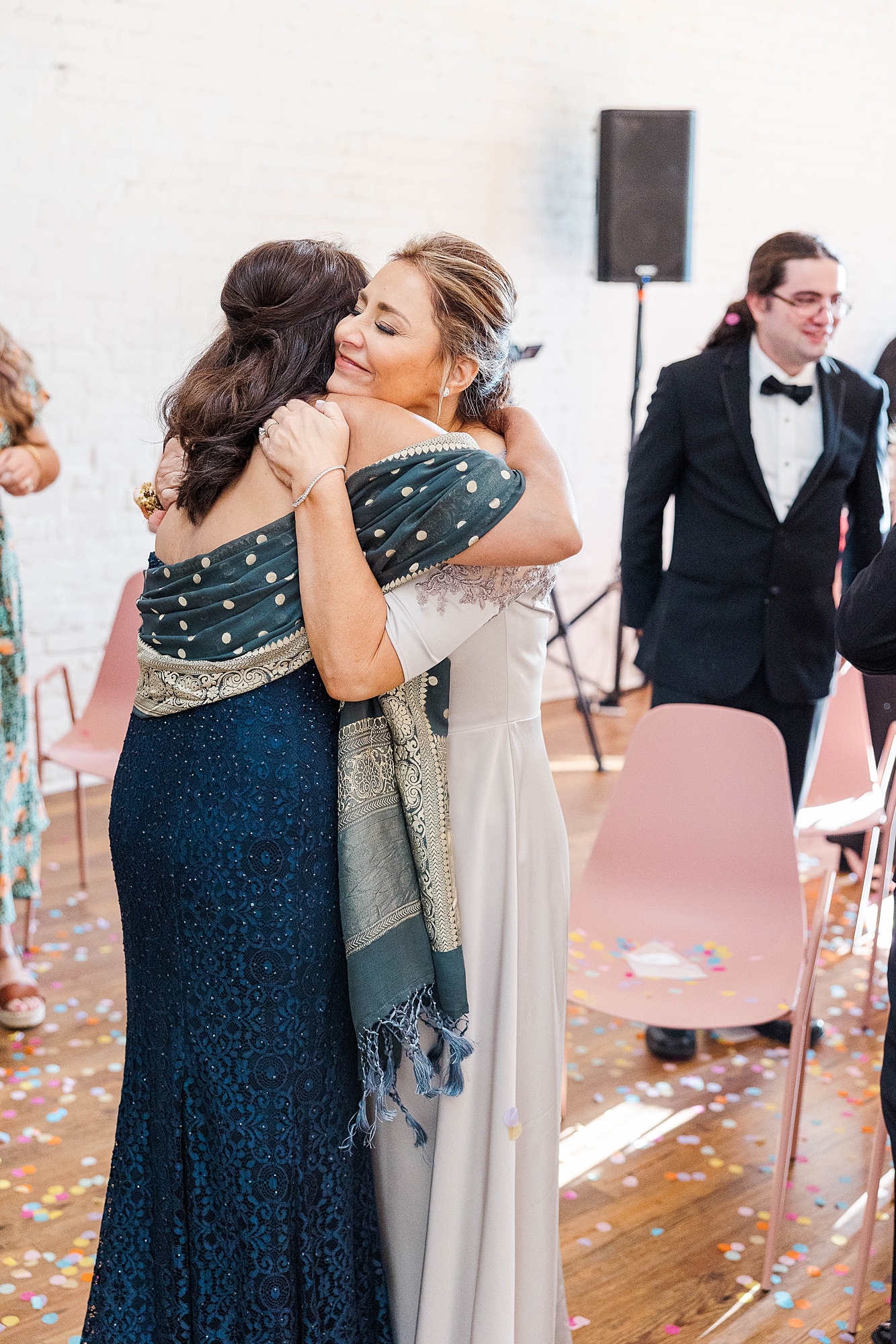 Autumn wedding ceremony with deep jewel tones, fun patterns and joyful family moments
